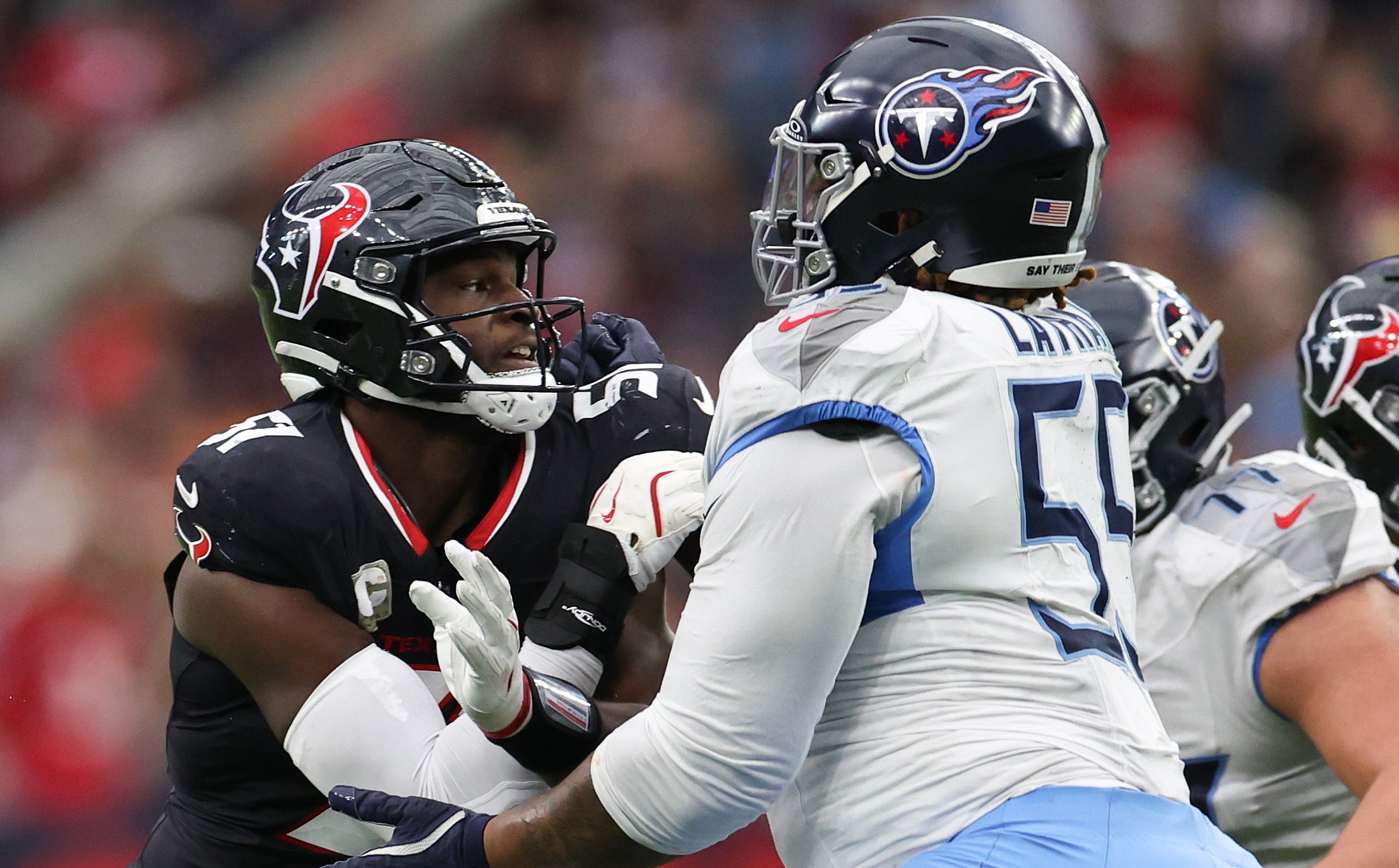 Houston Texans defensive end Will Anderson Jr. (51) rushes Tennessee Titans offensive tackle JC Latham (55) in the third quarter at NRG Stadium. Thomas Shea-Imagn Images