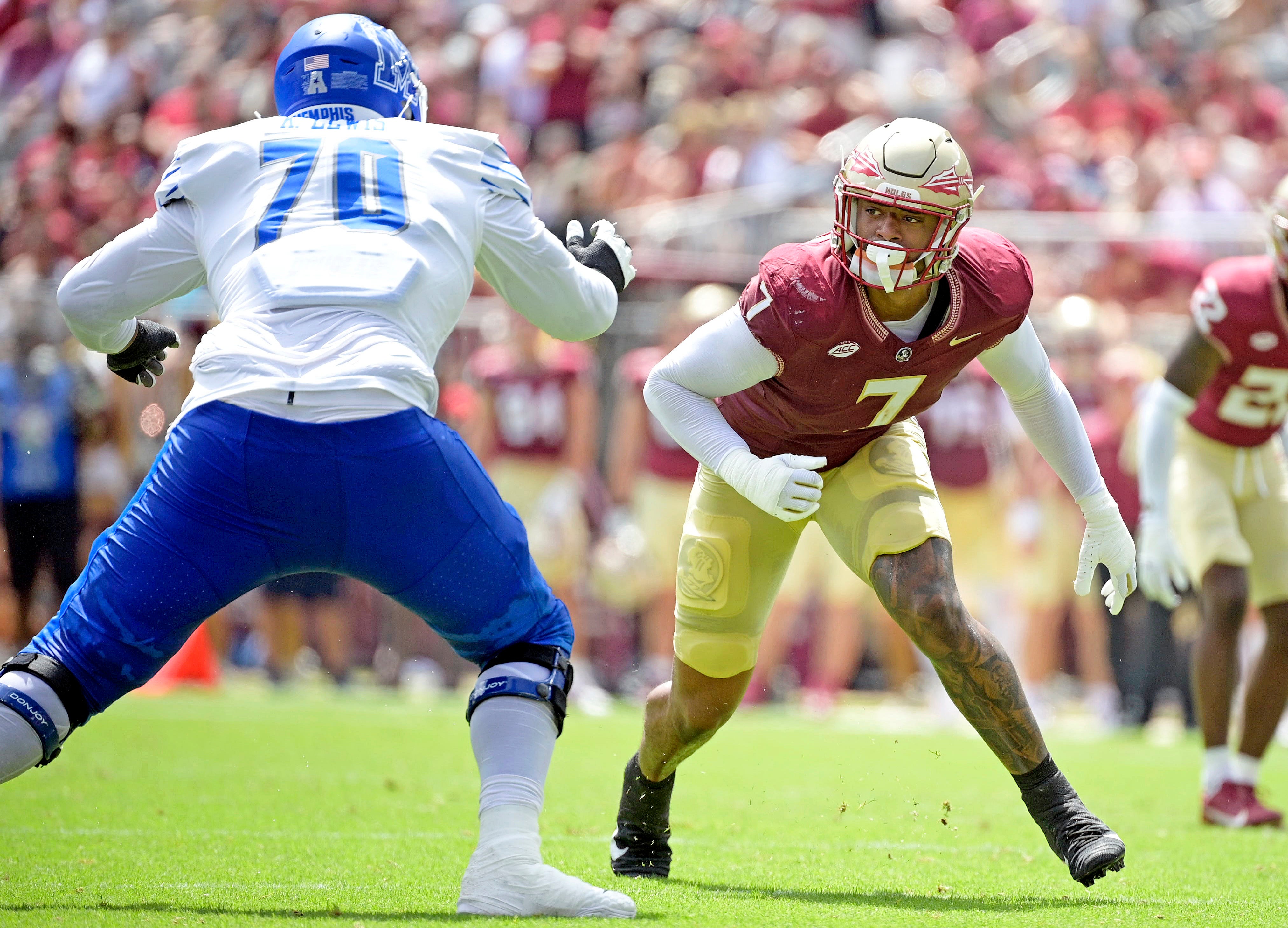 Sep 14, 2024; Tallahassee, Florida, USA; Florida State Seminoles defensive lineman Marvin Jones Jr. (7) pressures against the Memphis Tigers during the first half at Doak S. Campbell Stadium.