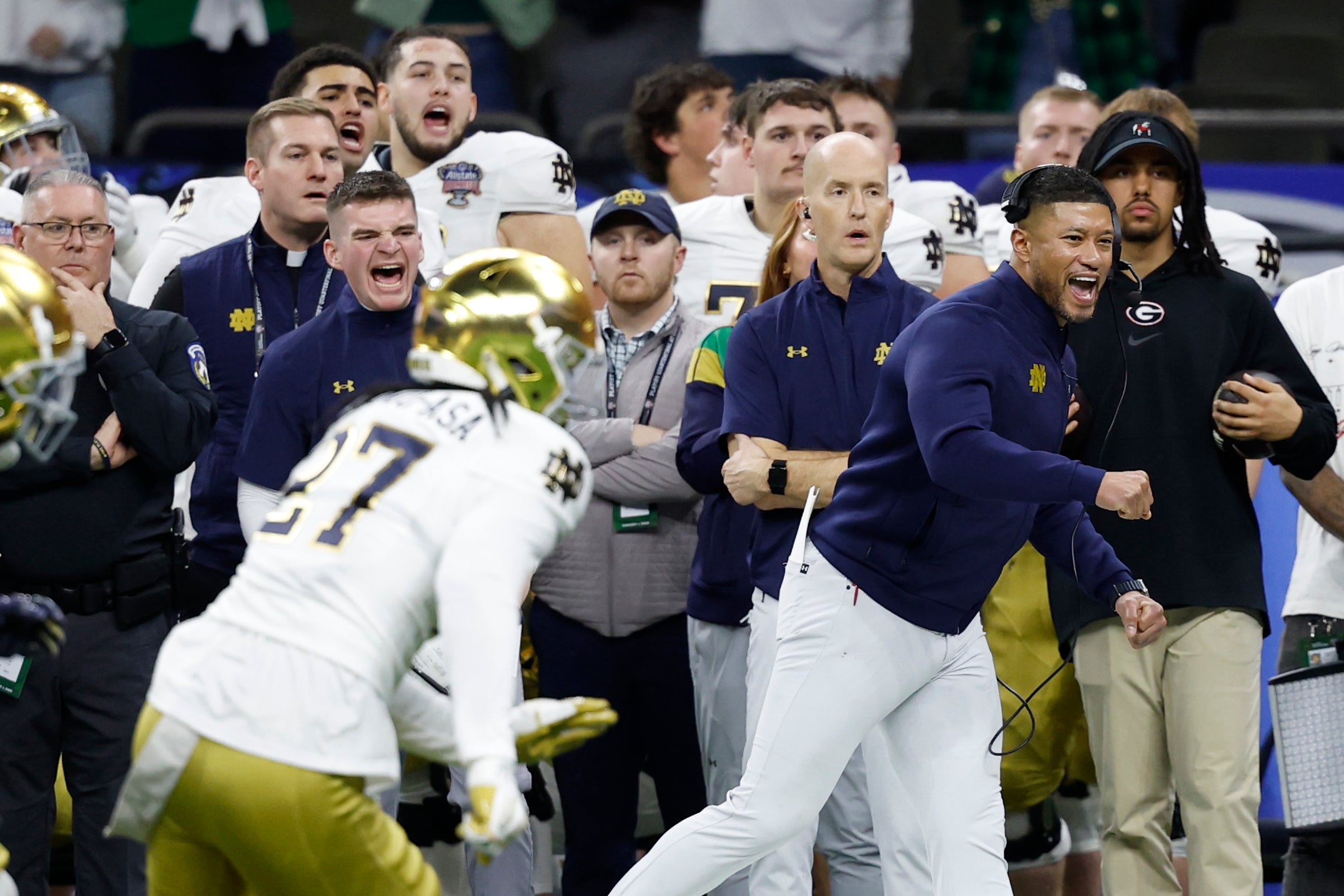 Notre Dame Fighting Irish head coach Marcus Freeman (R) reacts on the sidelines in the final minute against the Georgia Bulldogs during the fourth quarter at Caesars Superdome. 