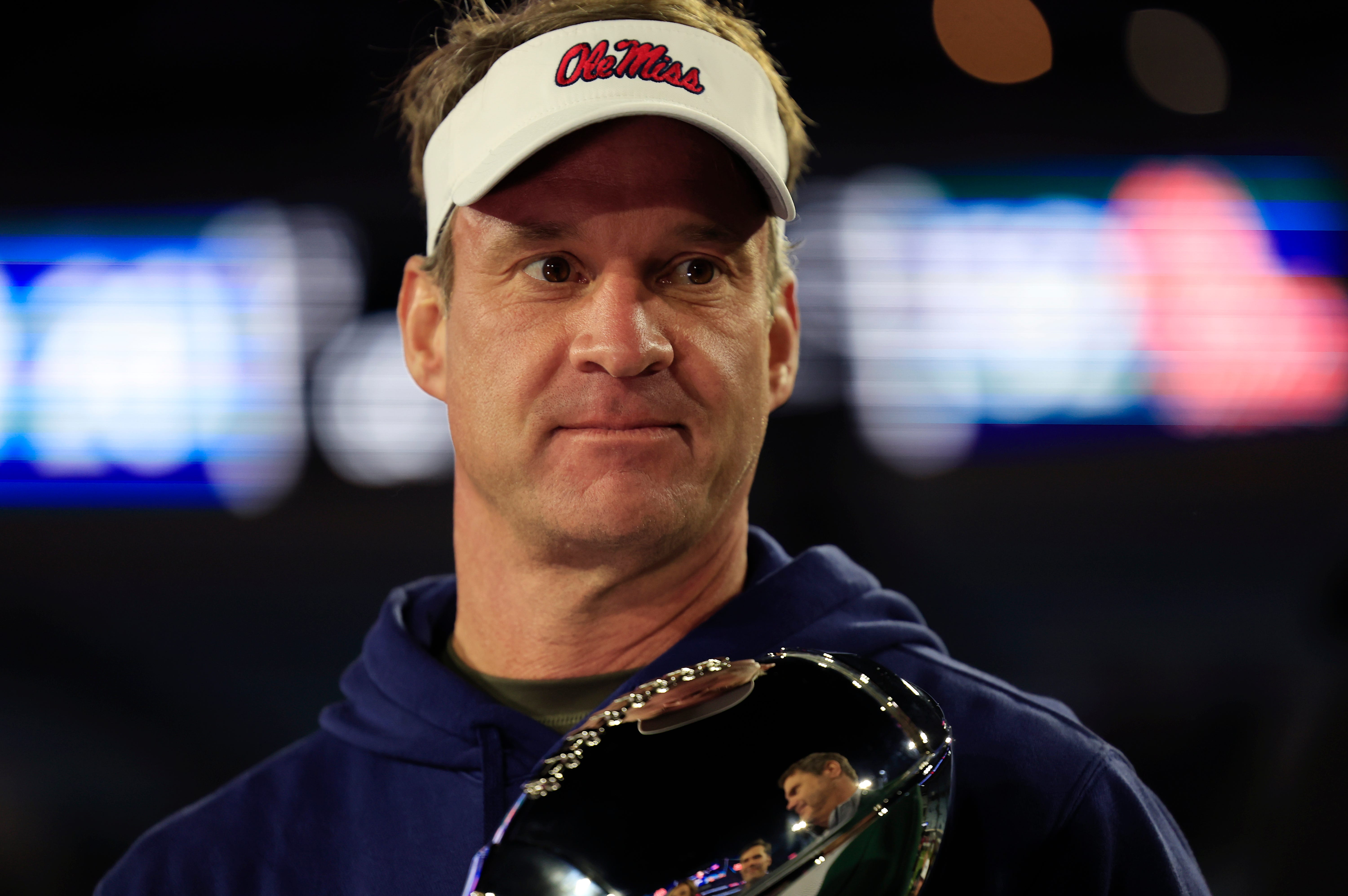 Mississippi Rebels head coach Lane Kiffin is interviewed after the game while holding the Ash Verlander Champions Trophy of the TaxSlayer Gator Bowl Thursday, Jan. 2, 2025 at EverBank Stadium in Jacksonville, Fla. Ole Miss defeated Duke 52-20. [Corey Perrine/Florida Times-Union]