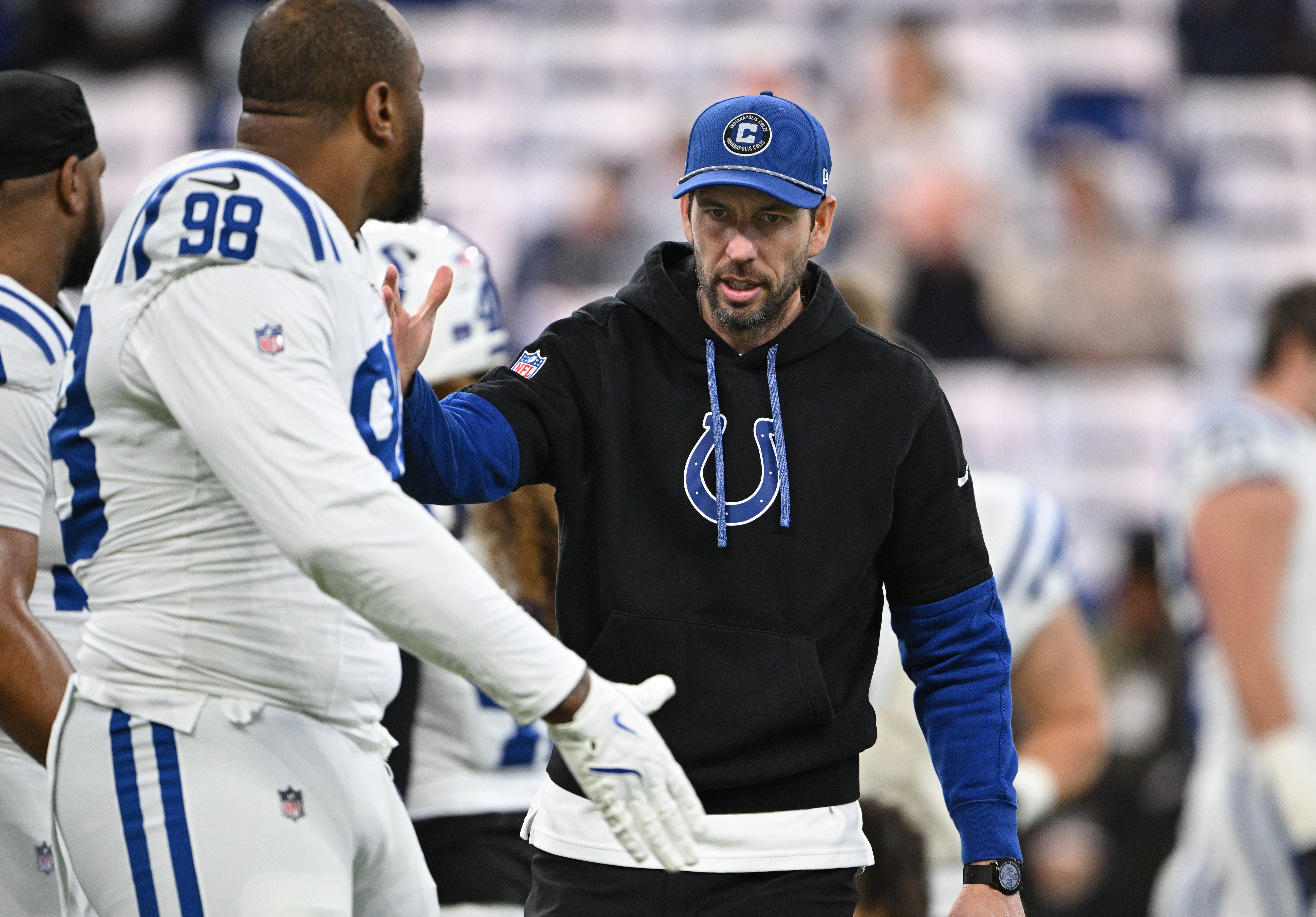 Dec 22, 2024; Indianapolis, Indiana, USA; Indianapolis Colts head coach Shane Steichen greets Indianapolis Colts defensive tackle Raekwon Davis (98) before the game against the Tennessee Titans at Lucas Oil Stadium.