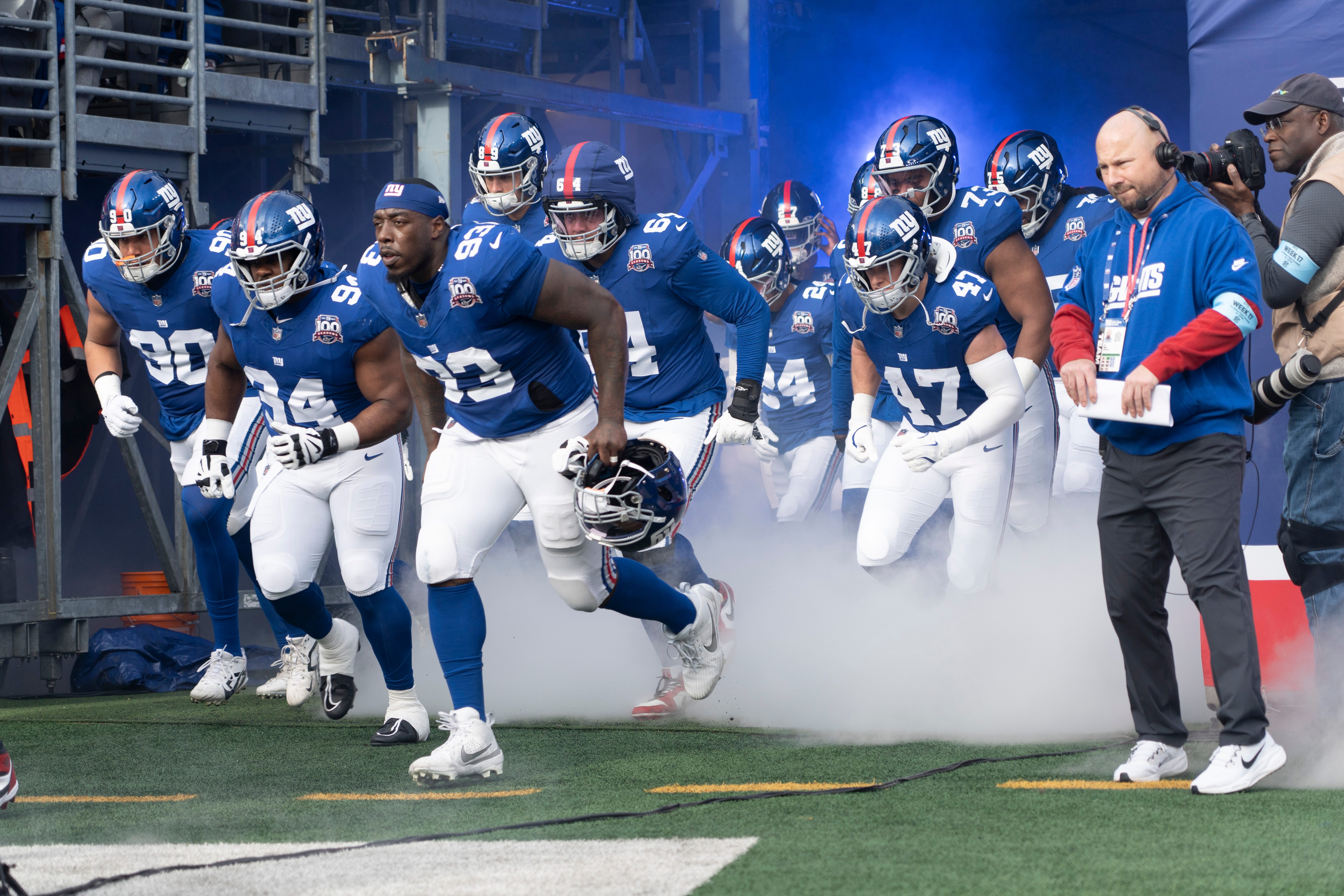 New York Giants players run out of the tunnel to start a game between New York Giants and Indianapolis Colts at MetLife Stadium on Sunday, Dec. 29, 2024.