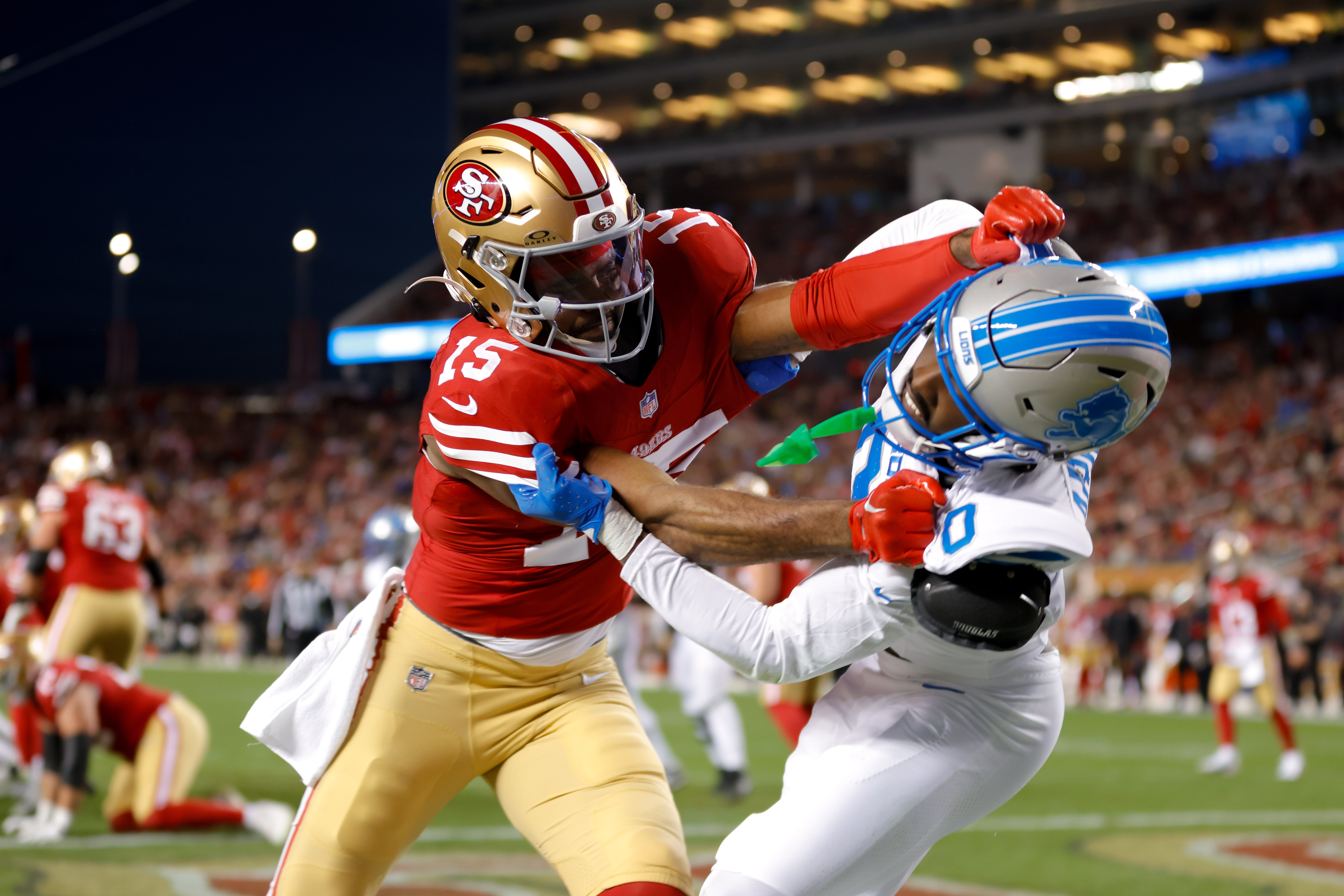 San Francisco 49ers wide receiver Jauan Jennings (15) and Detroit Lions cornerback Terrion Arnold (0) get tangled after a play during the first quarter at Levi's Stadium.