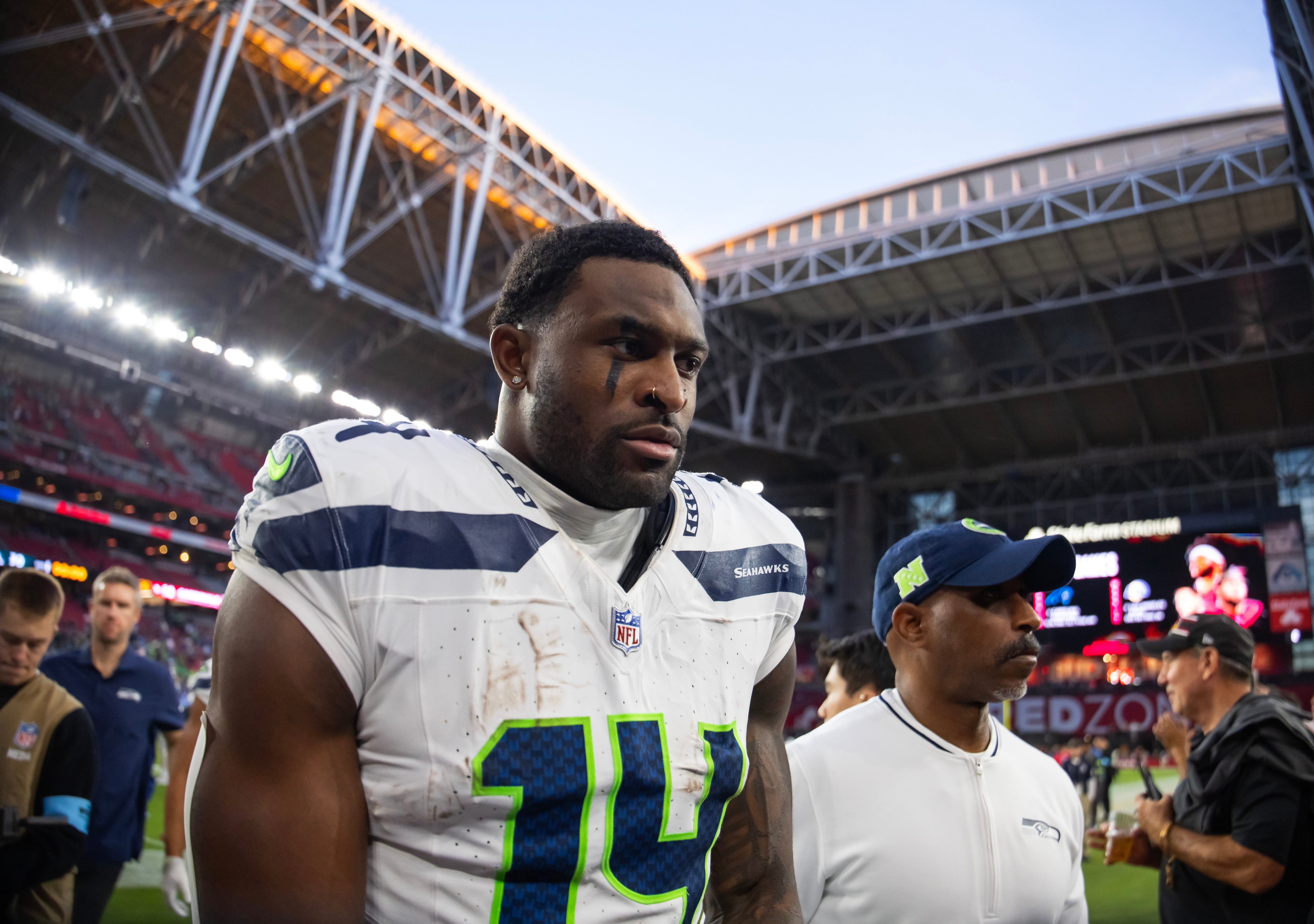 Dec 8, 2024; Glendale, Arizona, USA; Seattle Seahawks wide receiver DK Metcalf (14) against the Arizona Cardinals at State Farm Stadium. Mandatory Credit: Mark J. Rebilas-Imagn Images