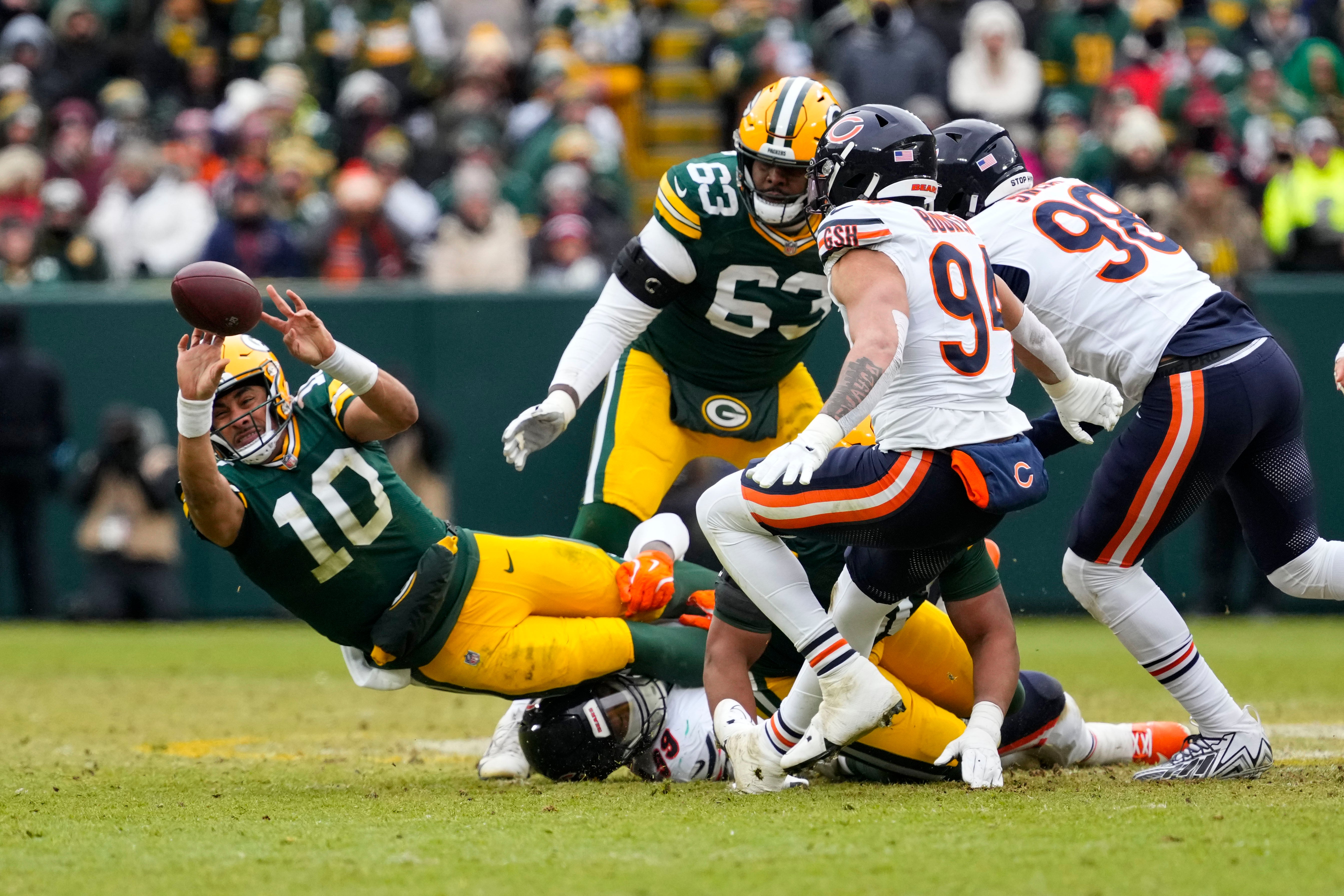 Green Bay Packers quarterback Jordan Love (10) tosses the football away during the second quarter against the Chicago Bears at Lambeau Field.