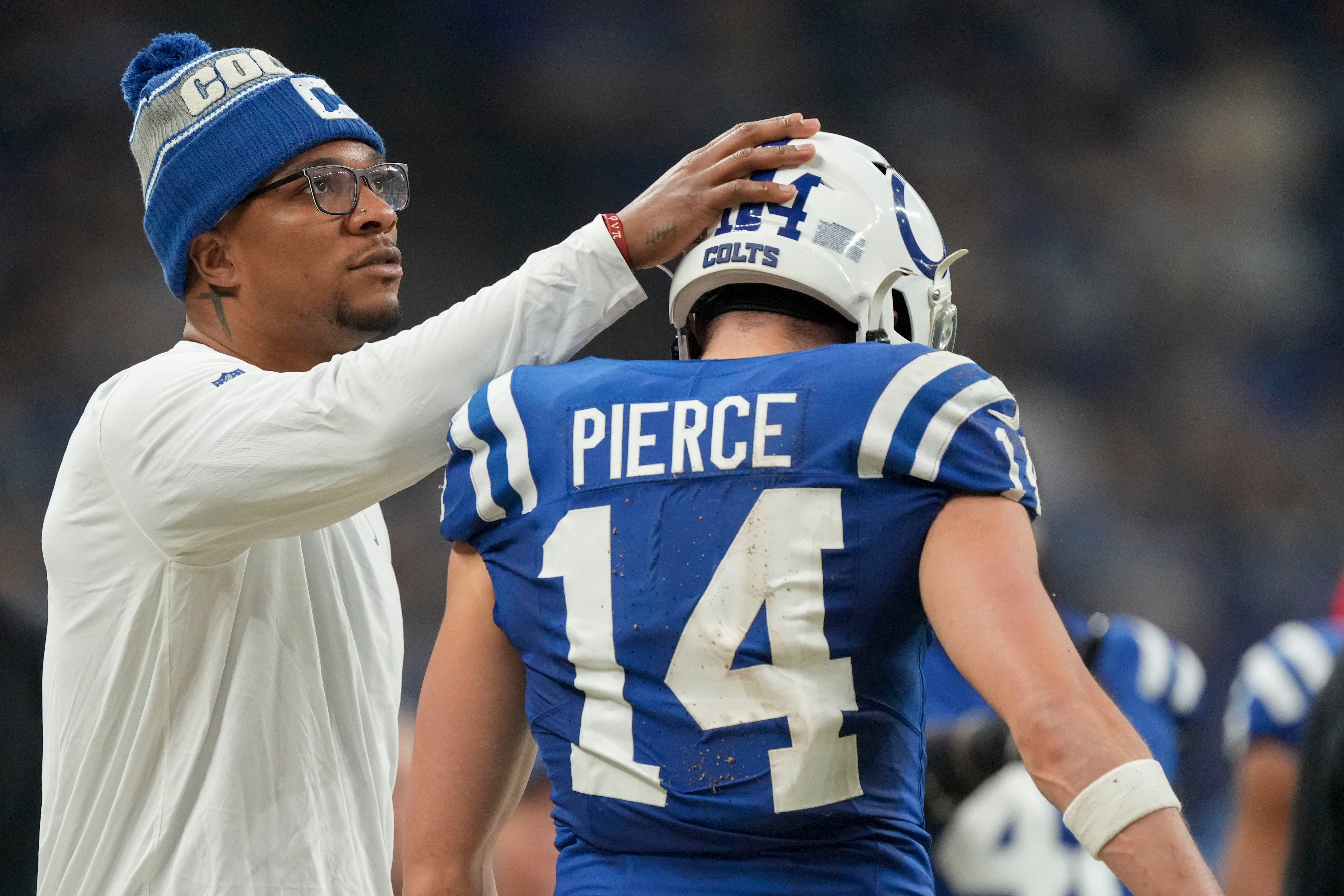 Indianapolis Colts quarterback Anthony Richardson (5) pats Indianapolis Colts wide receiver Alec Pierce (14) on the head as he leaves the field Sunday, Jan. 5, 2025, during a game against the Jacksonville Jaguars at Lucas Oil Stadium in Indianapolis.
