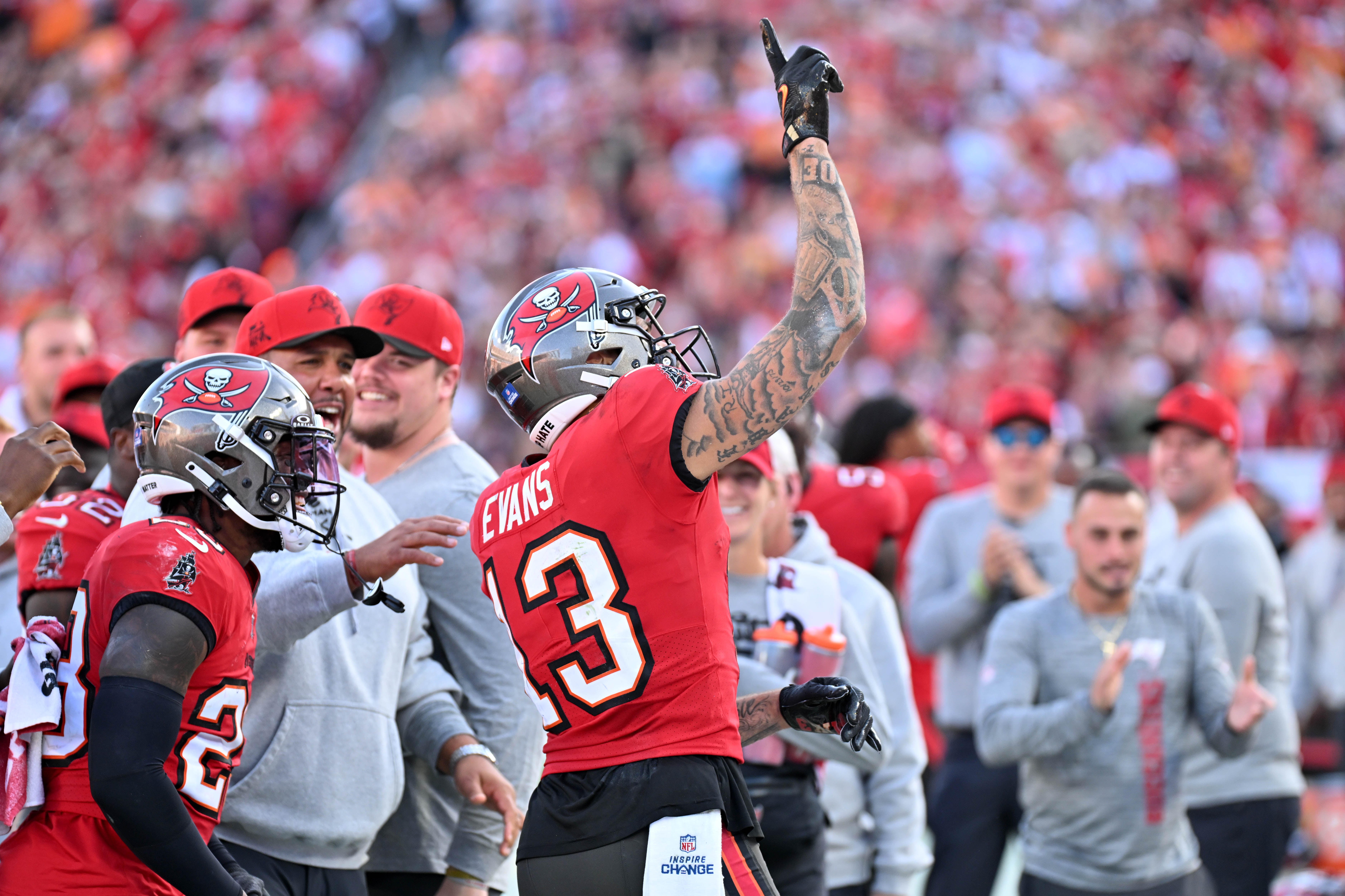 Jan 5, 2025; Tampa, Florida, USA; Tampa Bay Buccaneers wide receiver Mike Evans (13) celebrates after a reception to put him over 1,000 yards for the season in the second half against the New Orleans Saints at Raymond James Stadium.