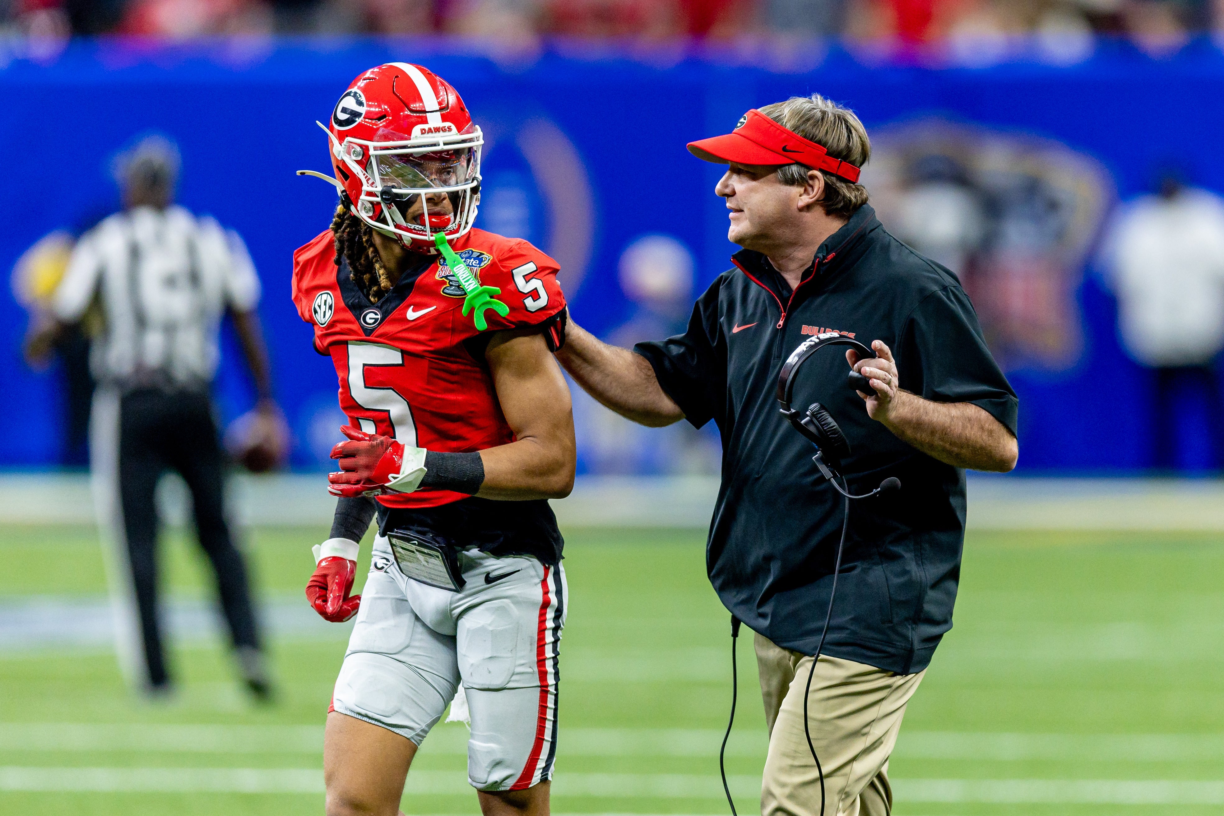 Jan 2, 2025; New Orleans, LA, USA; Georgia Bulldogs head coach Kirby Smart talks to wide receiver Anthony Evans III (5) before the kick off from the Notre Dame Fighting Irish during the first half at Caesars Superdome.