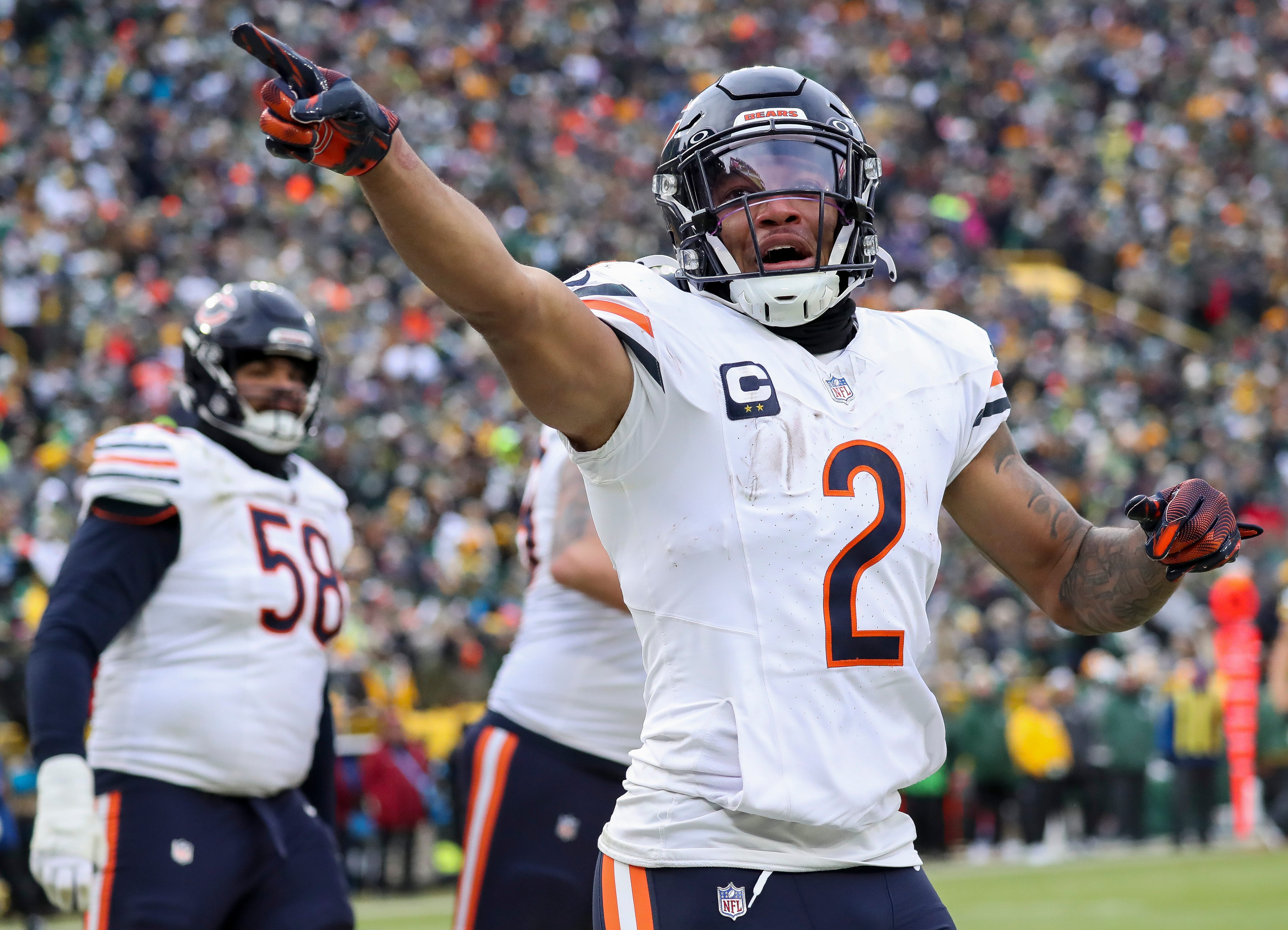 Chicago Bears wide receiver DJ Moore (2) gestures to the crowd after scoring a touchdown against the Green Bay Packers on Sunday, January 5, 2025, at Lambeau Field in Green Bay, Wis.