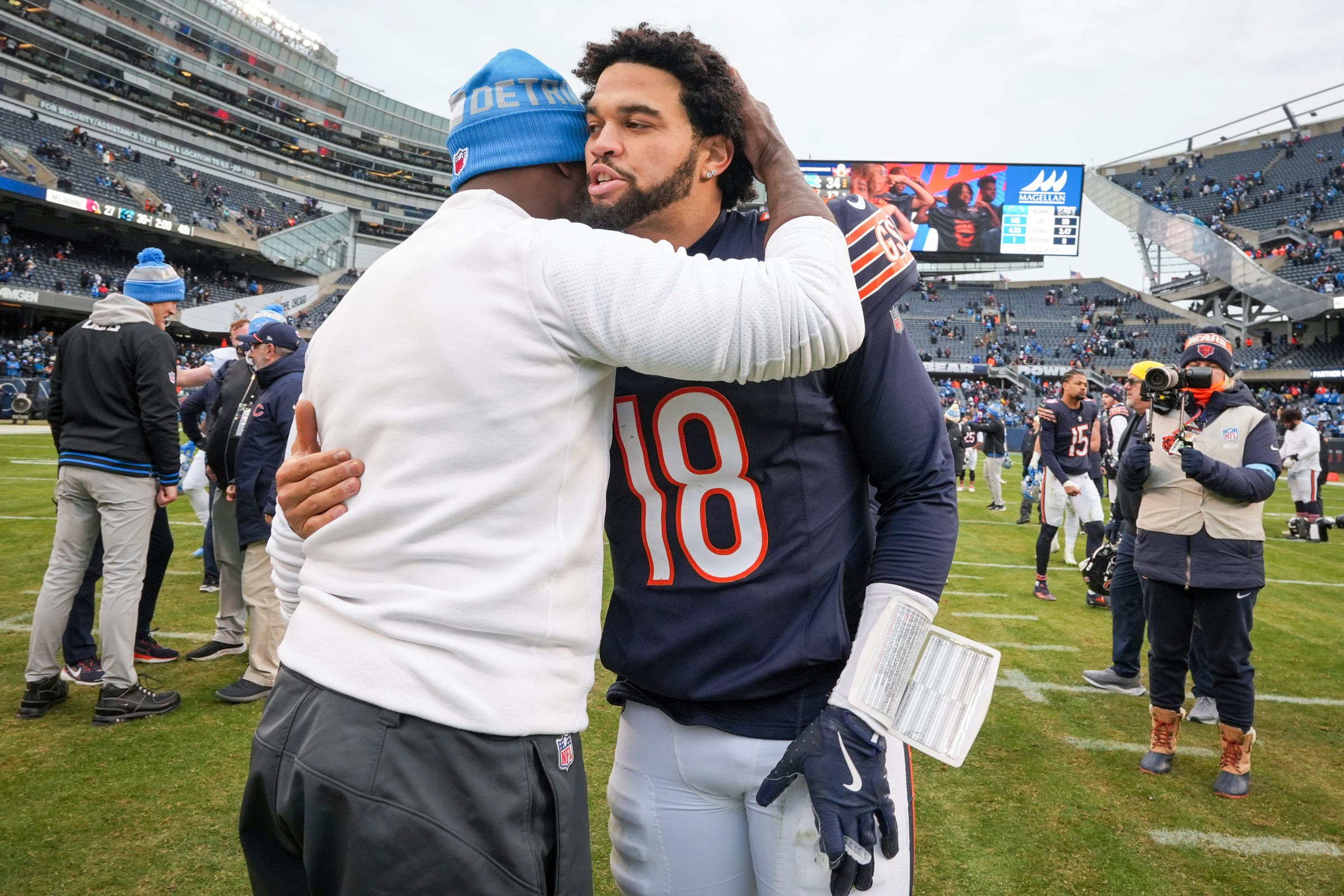 Detroit Lions defensive coordinator Aaron Glenn embraces Chicago Bears quarterback Caleb Williams (18) after a game at Soldier Field in Chicago, Ill., on Sunday, Dec. 22, 2024. The Lions defeated the Bears with a score of 34-17.