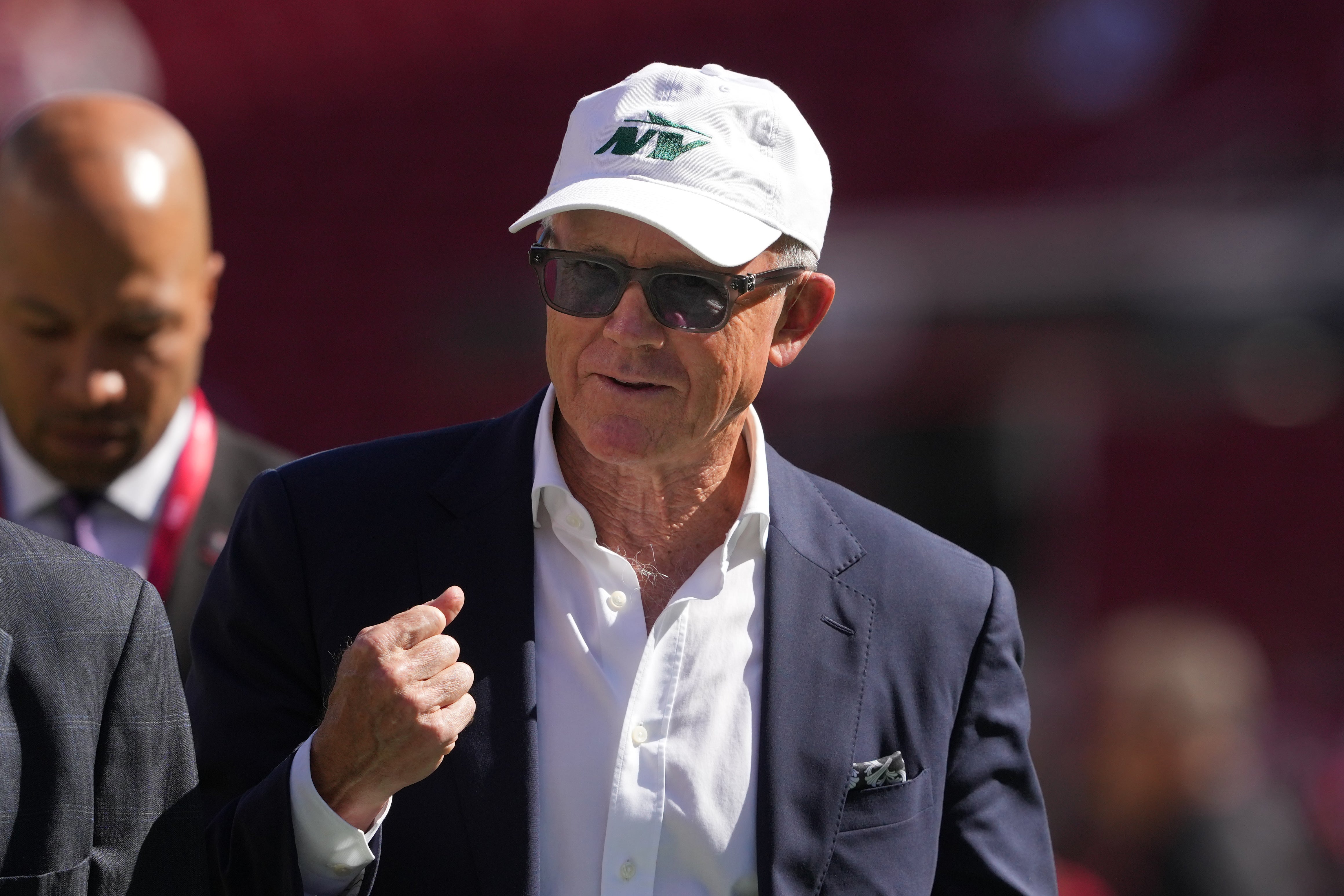 New York Jets owner Woody Johnson walks on the field before the game against the San Francisco 49ers at Levi's Stadium.