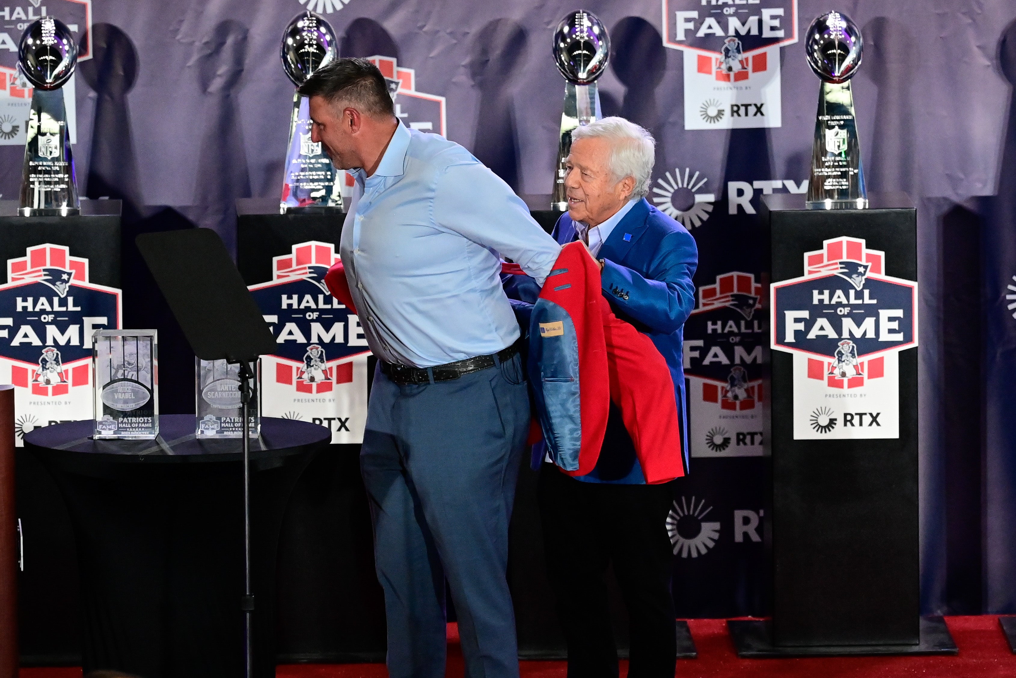 Oct 21, 2023; Foxborough, MA, USA; New England Patriots former linebacker and current Tennessee Titans head coach Mike Vrabel receives his red jacket from Patriots owner Robert Kraft at the 2023 New England Patriots Hall of Fame induction at the Cross Insurance Pavilion at Gillette Stadium.