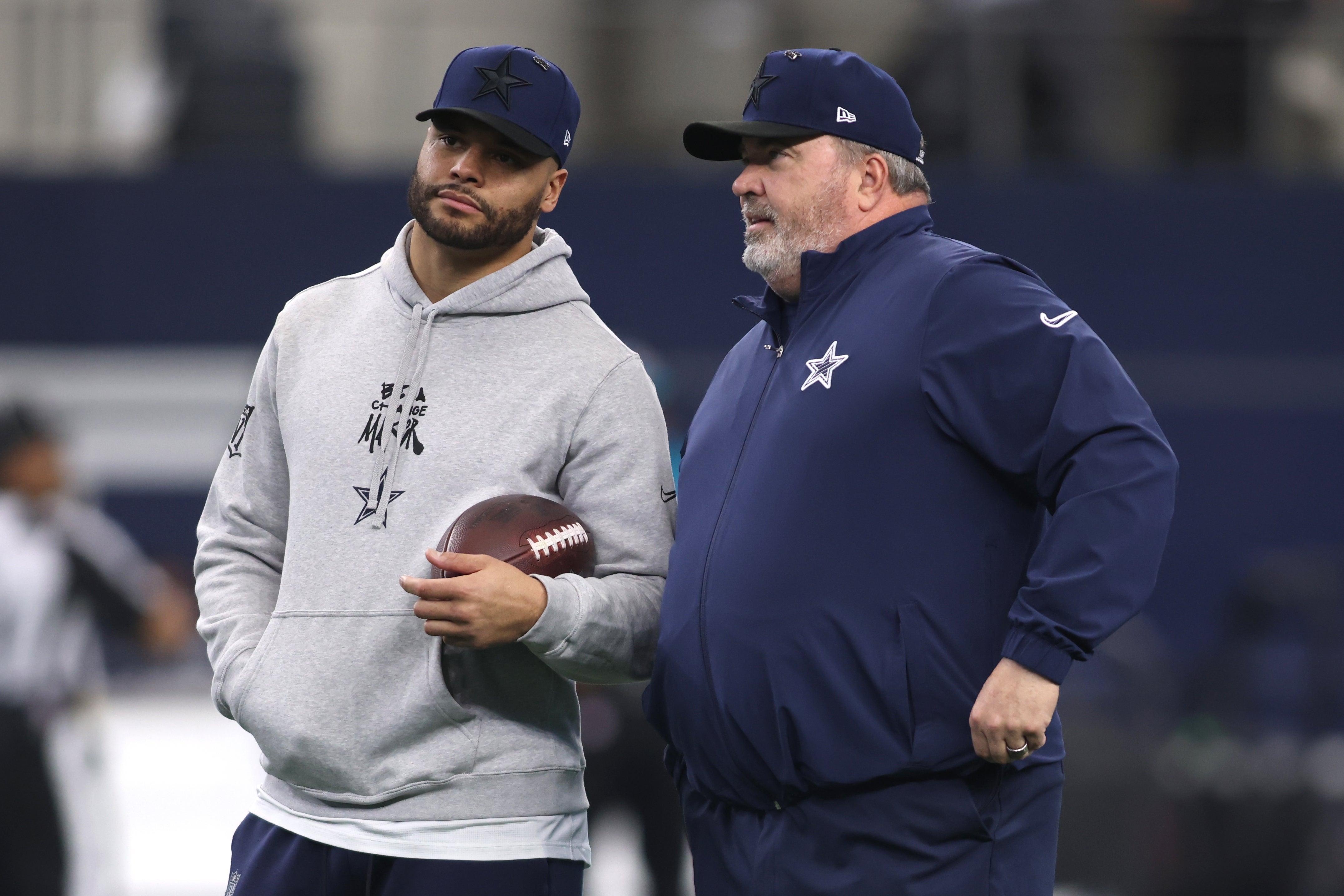 Dallas Cowboys quarterback Dak Prescott (4) talks to head coach Mike McCarthy before the game against the Washington Commanders at AT&T Stadium.