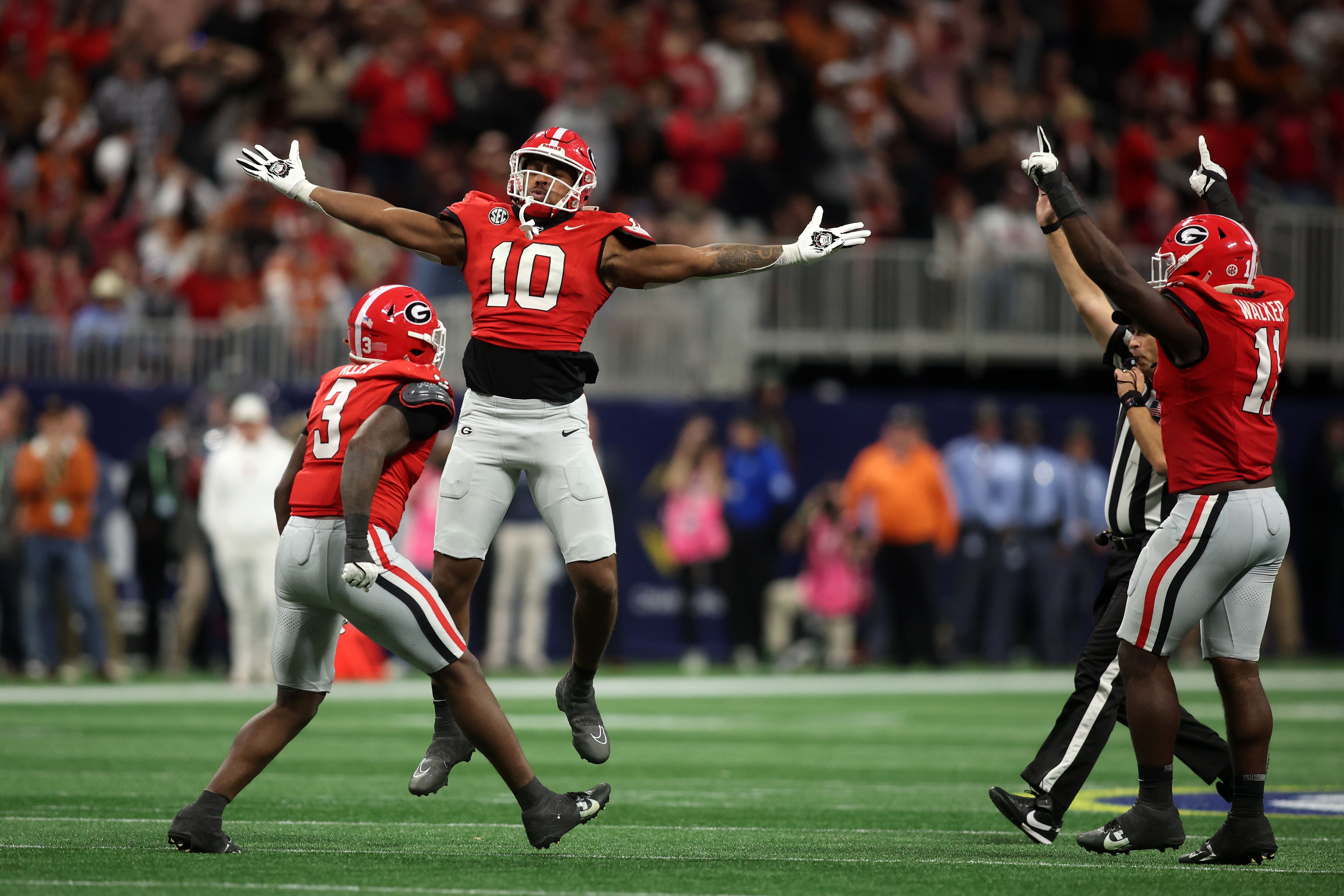 Dec 7, 2024; Atlanta, GA, USA; Georgia Bulldogs linebacker Damon Wilson II (10), linebacker Jalon Walker (11) and linebacker CJ Allen (3) react during the second half in the 2024 SEC Championship game at Mercedes-Benz Stadium.