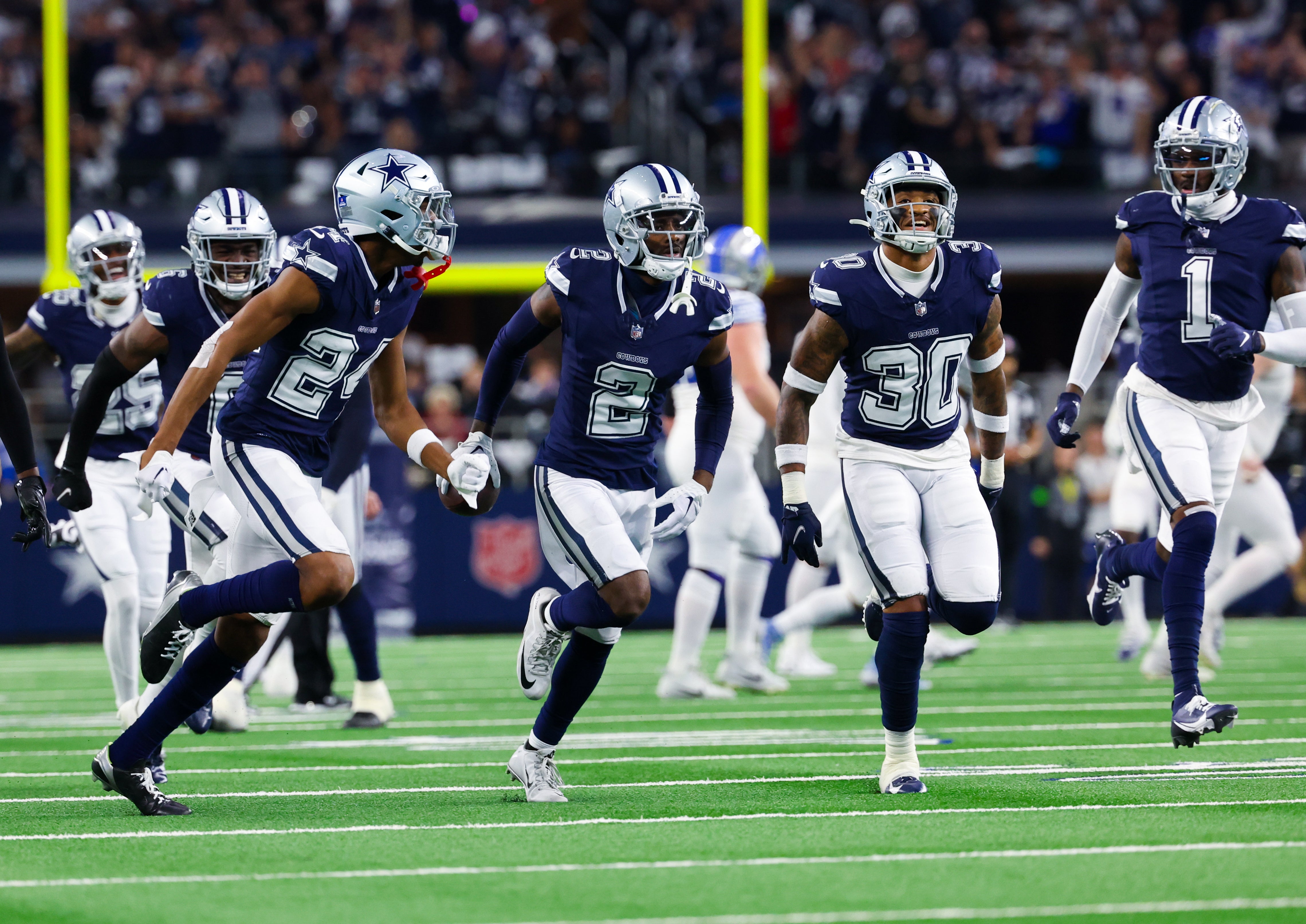 Dallas Cowboys cornerback Jourdan Lewis (2) celebrates with teammates after making an interception during the first half against the Detroit Lions at AT&T Stadium.
