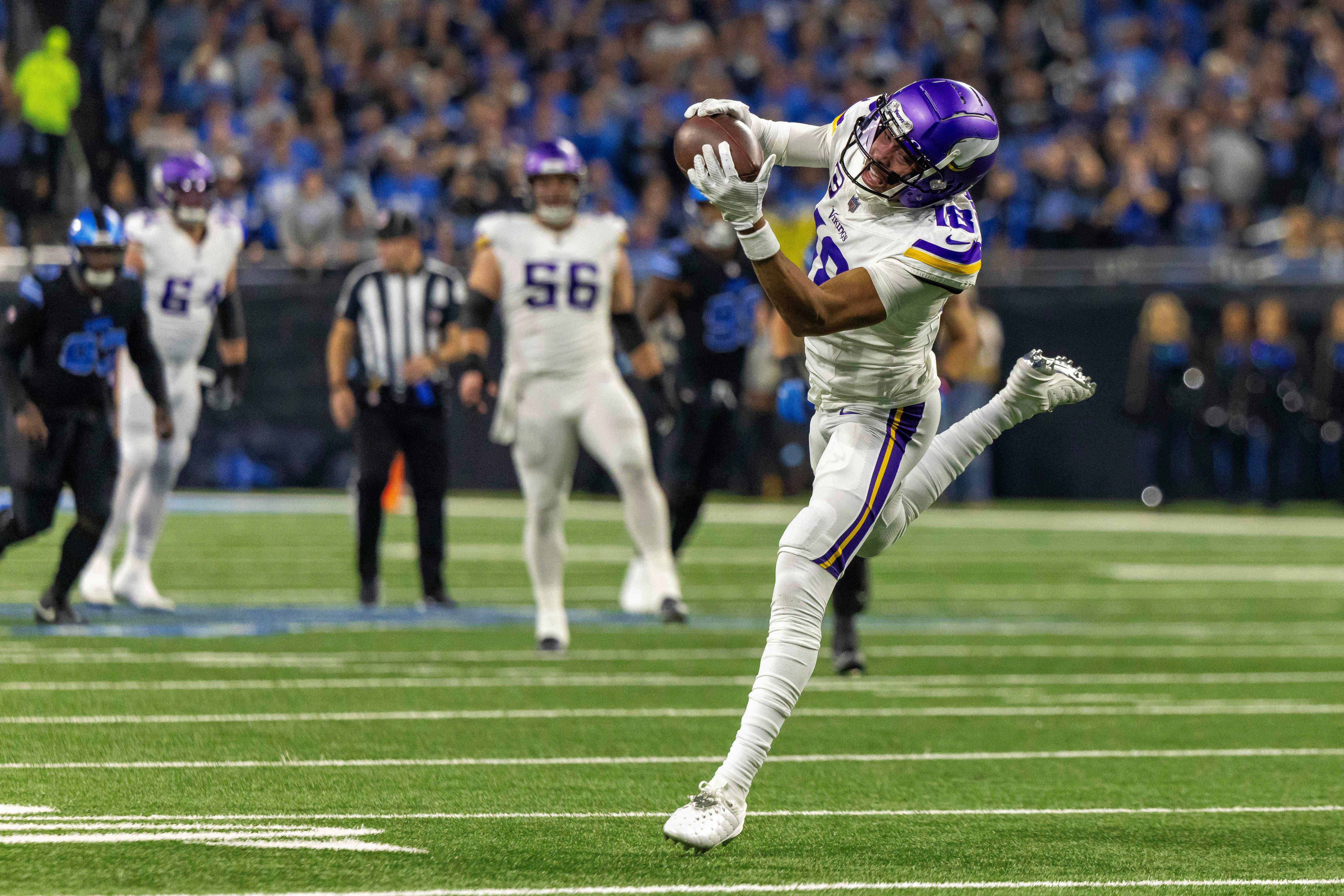 Jan 5, 2025; Detroit, Michigan, USA; Minnesota Vikings wide receiver Justin Jefferson (18) makes a catch against the Detroit Lions during the first half at Ford Field.