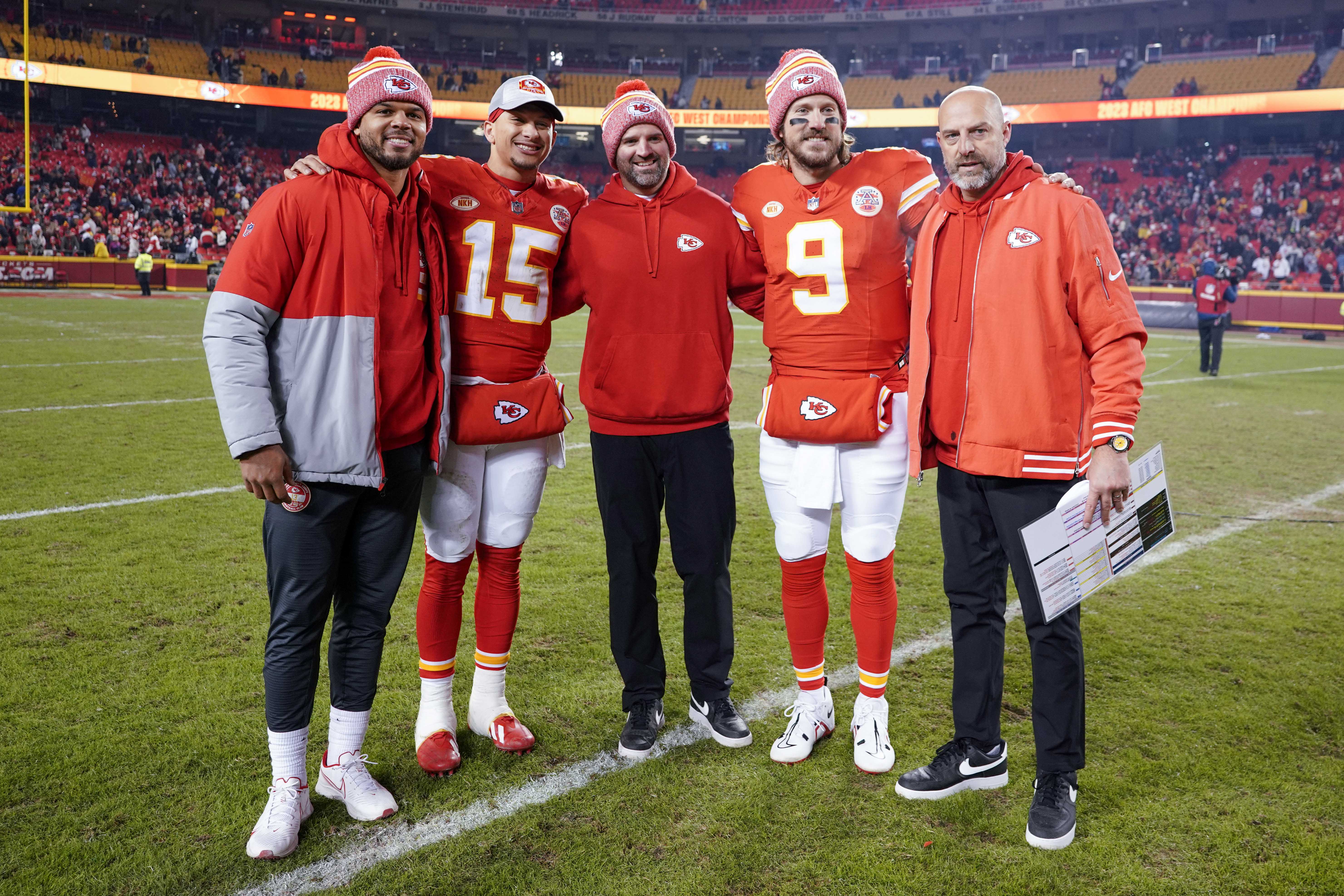 Dec 31, 2023; Kansas City, Missouri, USA; Kansas City Chiefs quarterback Chris Oladokun (13) and quarterback Patrick Mahomes (15) and quarterbacks coach David Girardi and quarterback Blaine Gabbert (9) and offensive coordinator Matt Nagy (left to right) pose for a photo after the game against the Cincinnati Bengals at GEHA Field at Arrowhead Stadium. Mandatory Credit: Denny Medley-Imagn Images  