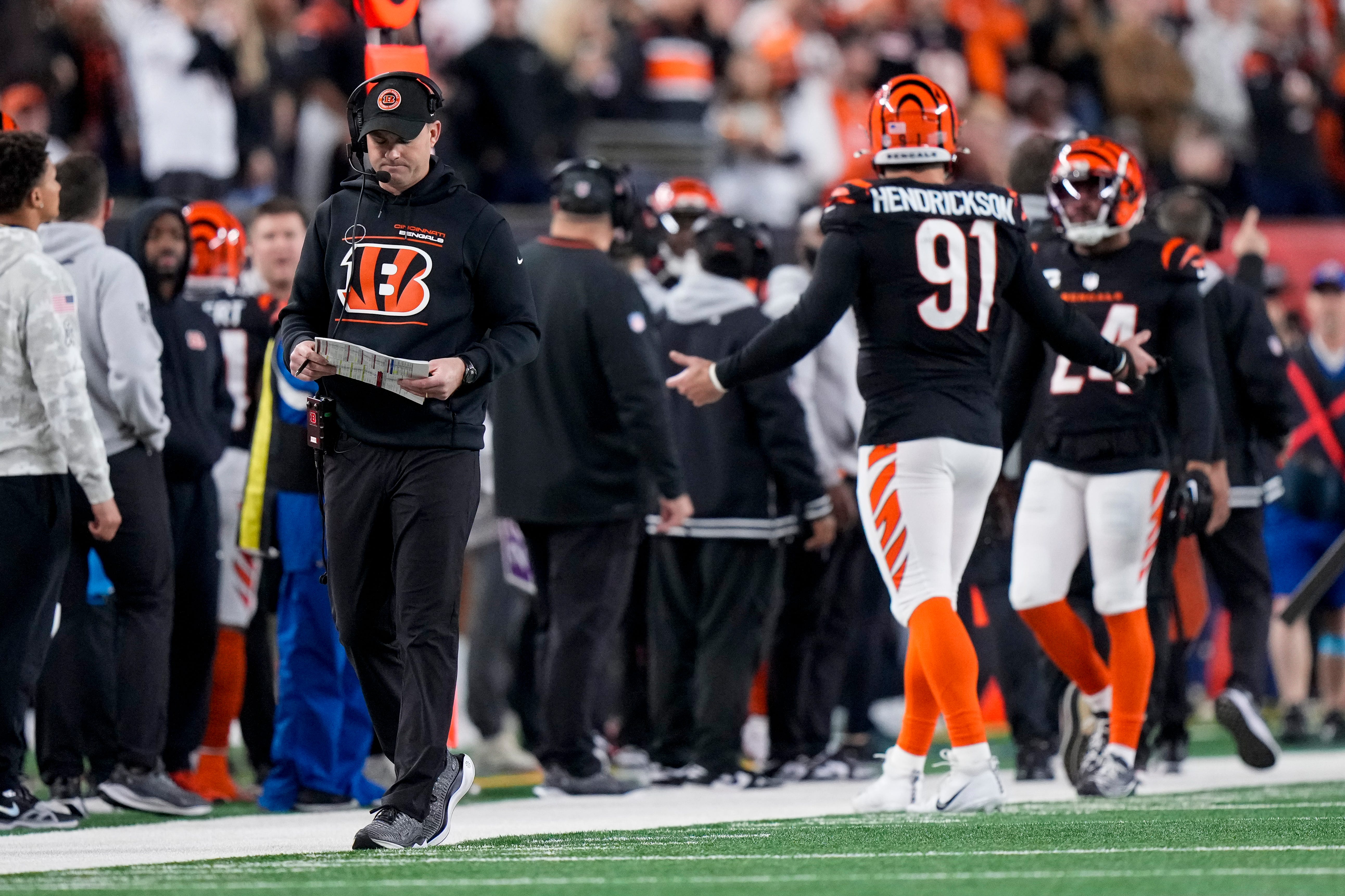 Cincinnati Bengals head coach Zac Taylor walks the sideline as the defense returns after giving up a touchdown in the fourth quarter of the NFL Week 17 game between the Cincinnati Bengals and the Denver Broncos at Paycor Stadium in downtown Cincinnati on Saturday, Dec. 28, 2024. The Bengals took a 30-24 win in overtime to remain in the post season chase.  