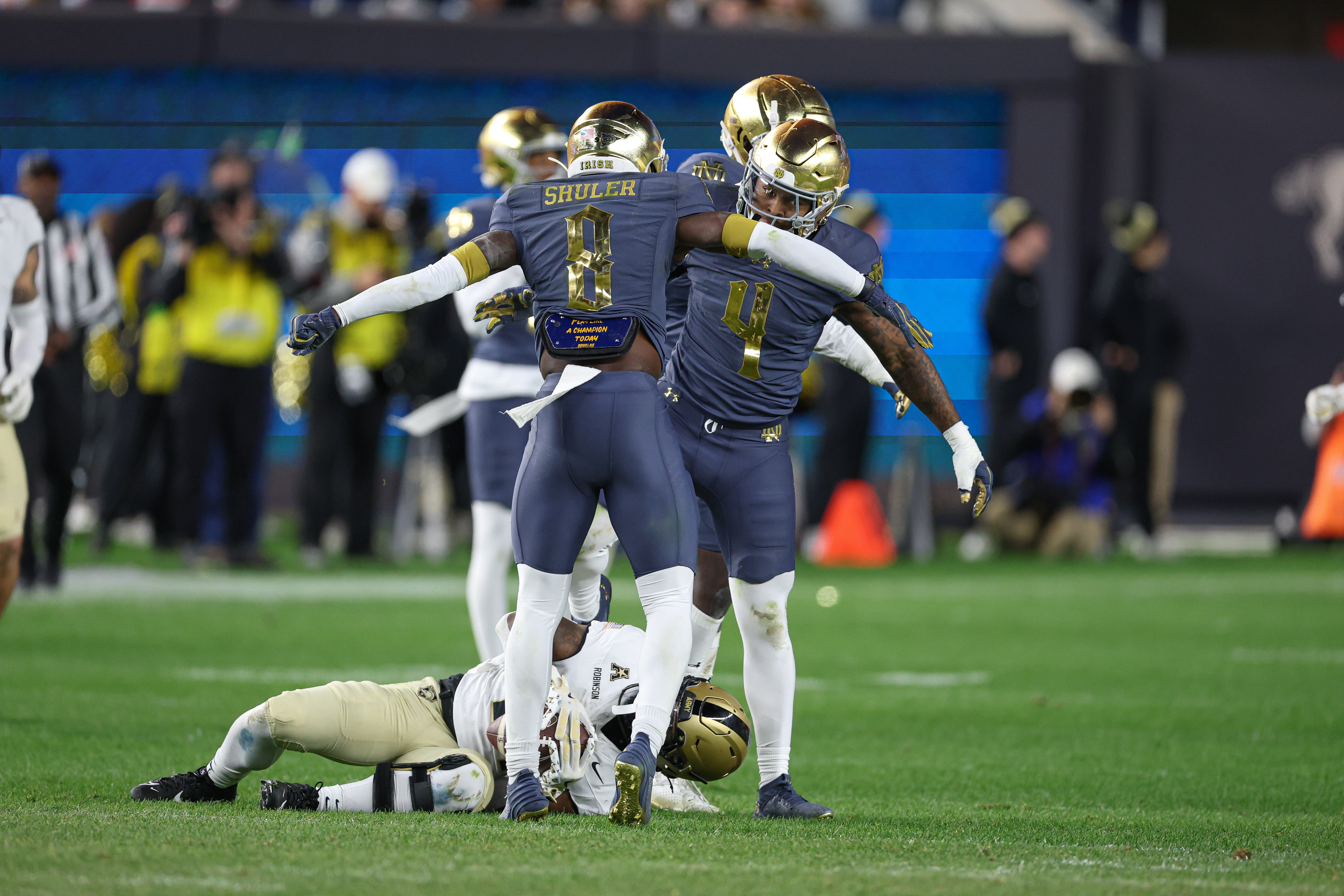Notre Dame Fighting Irish linebacker Jaiden Ausberry (4) and safety Adon Shuler (8) celebrate a defensive stop during the second half against the Army Black Knights at Yankee Stadium.