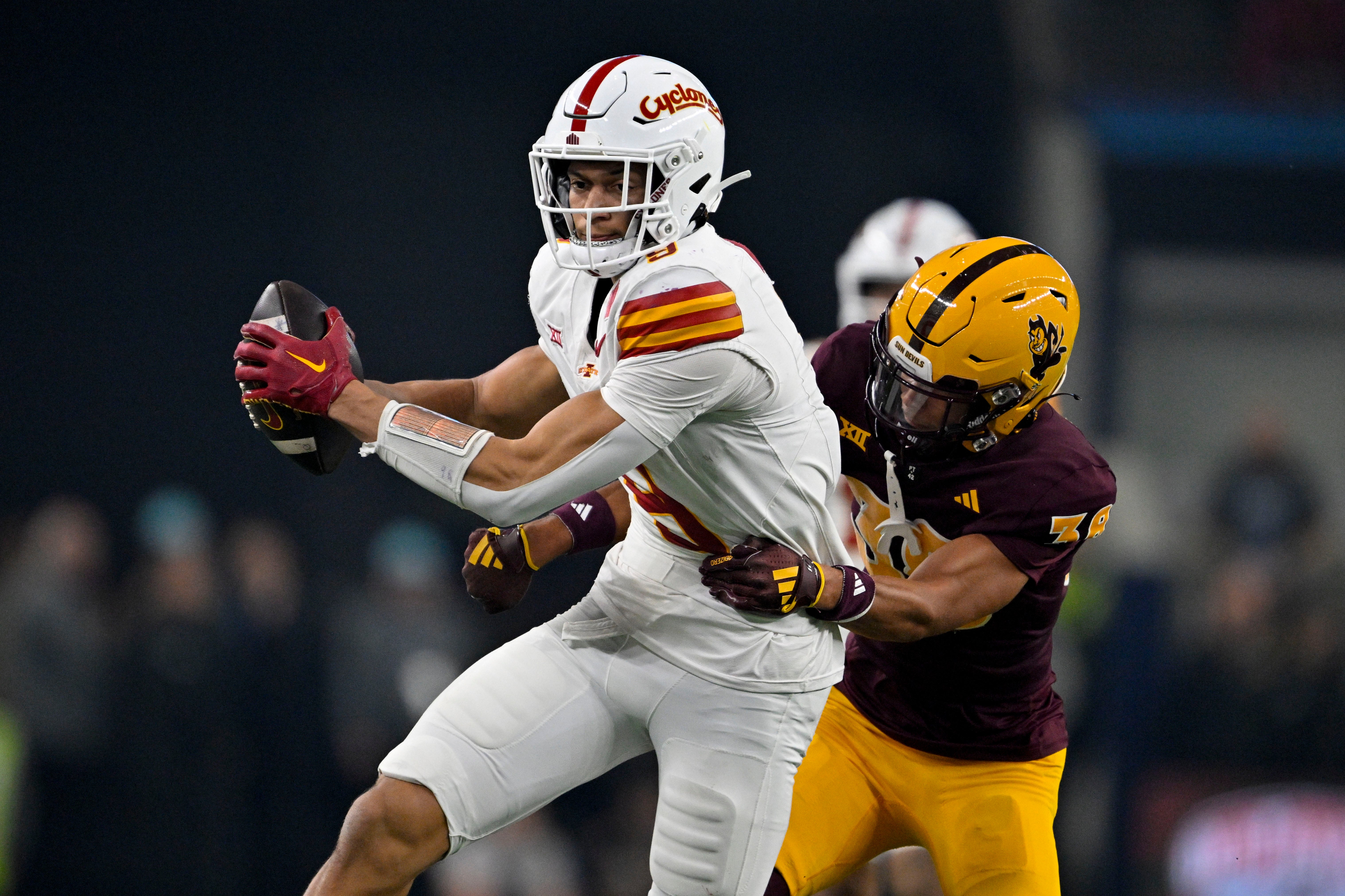 Iowa State Cyclones wide receiver Jayden Higgins (9) and Arizona State Sun Devils defensive back Kyan McDonald (38) in action during the game between the Iowa State Cyclones and the Arizona State Sun Devils at AT&T Stadium.