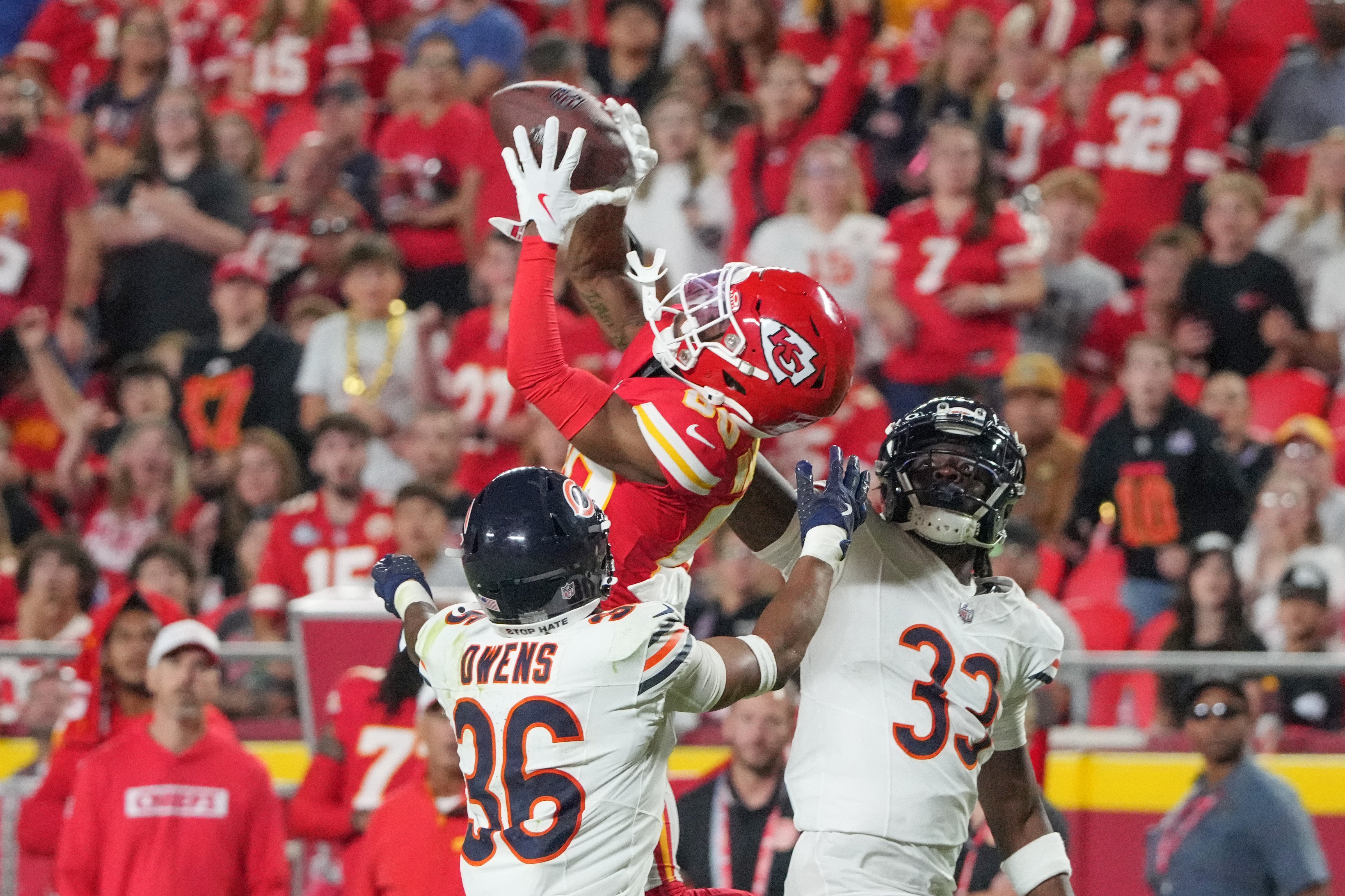 Aug 22, 2024; Kansas City, Missouri, USA; Kansas City Chiefs wide receiver Montrell Washington (80) catches a pass as Chicago Bears cornerback Ro Torrence (33) and safety Jonathan Owens (36) defend during the second half at GEHA Field at Arrowhead Stadium.