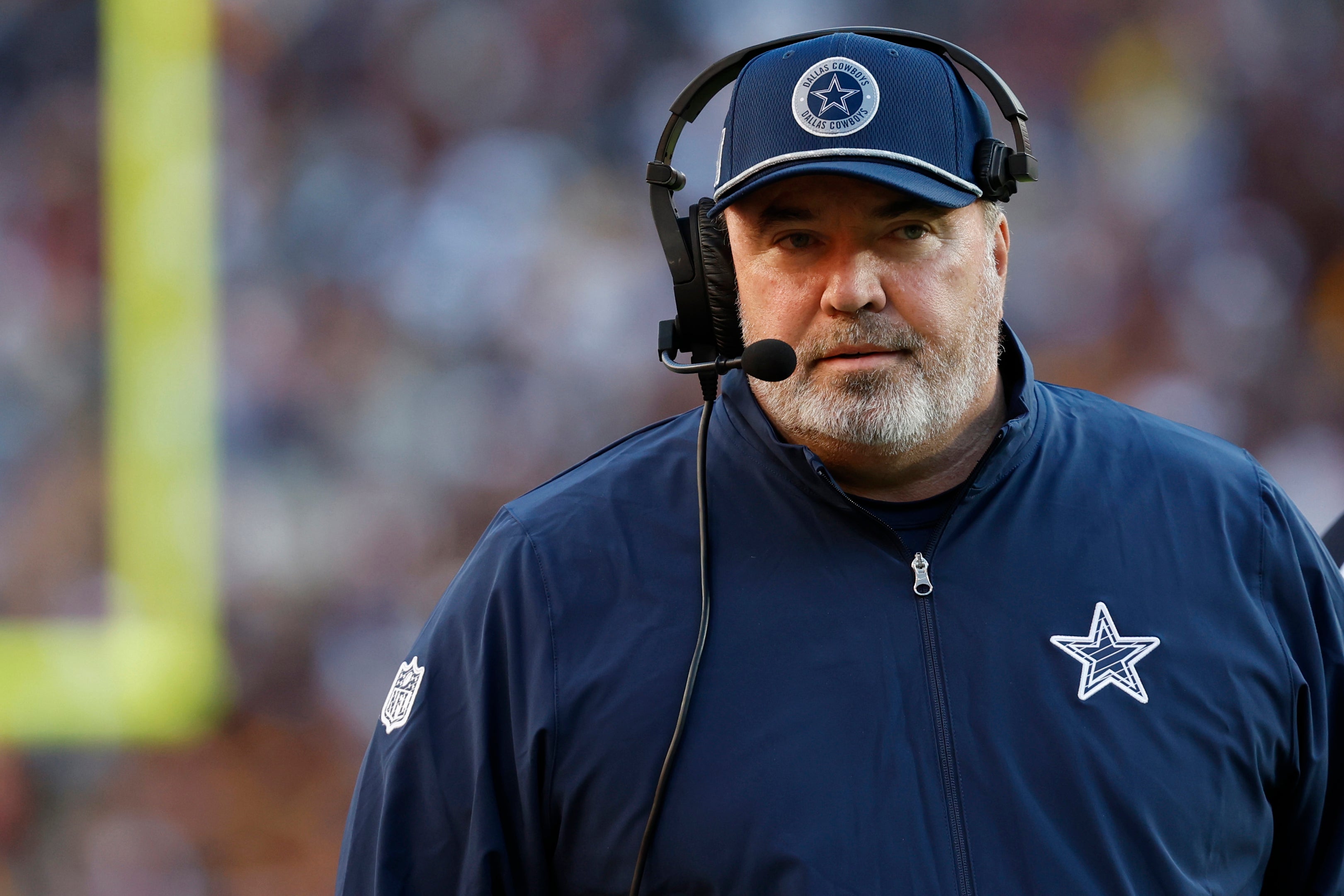Dallas Cowboys head coach Mike McCarthy stands on the sidelines against the Washington Commanders at Northwest Stadium.