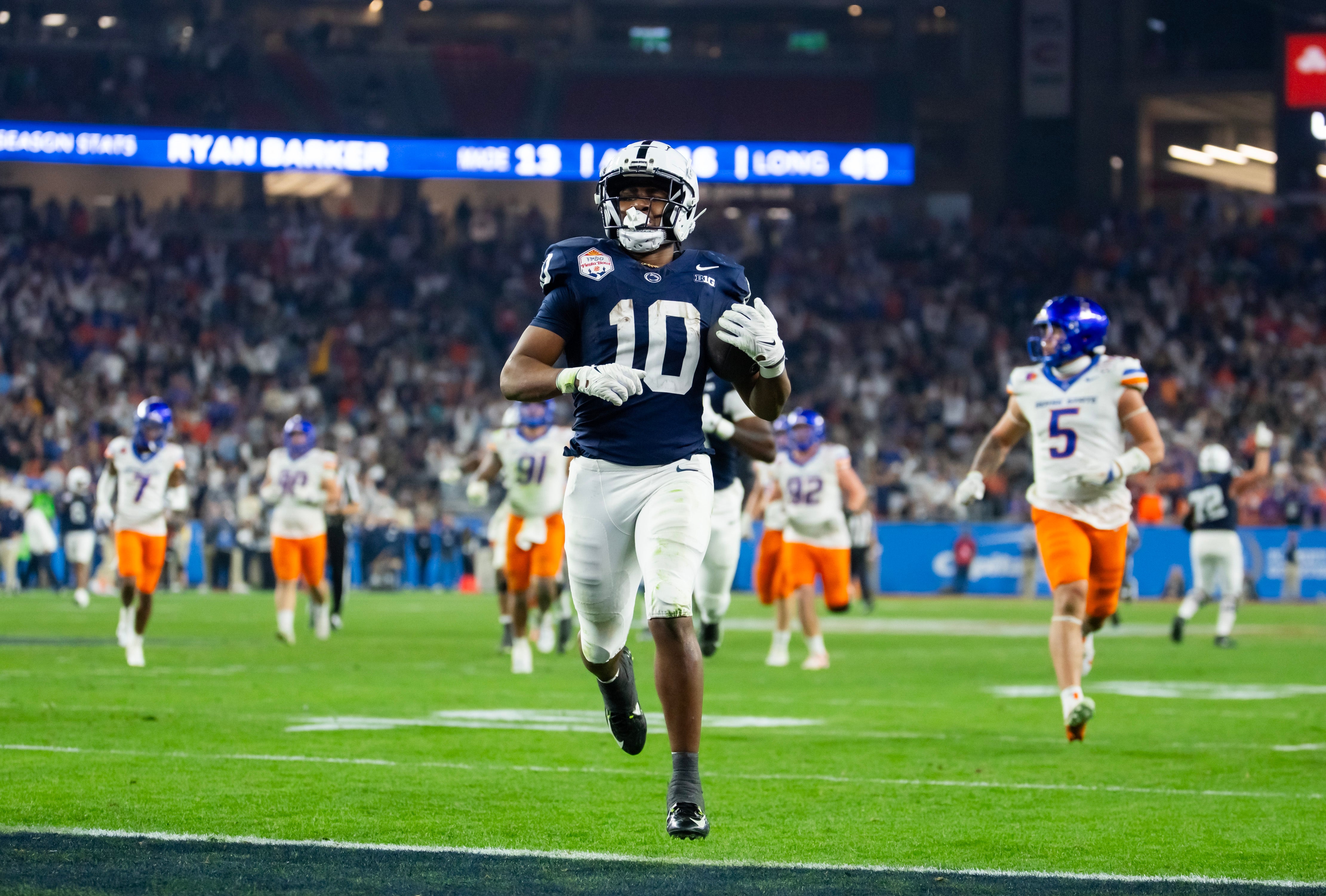 Penn State Nittany Lions running back Nicholas Singleton (10) rushes for a touchdown against the Boise State Broncos during the Fiesta Bowl at State Farm Stadium.