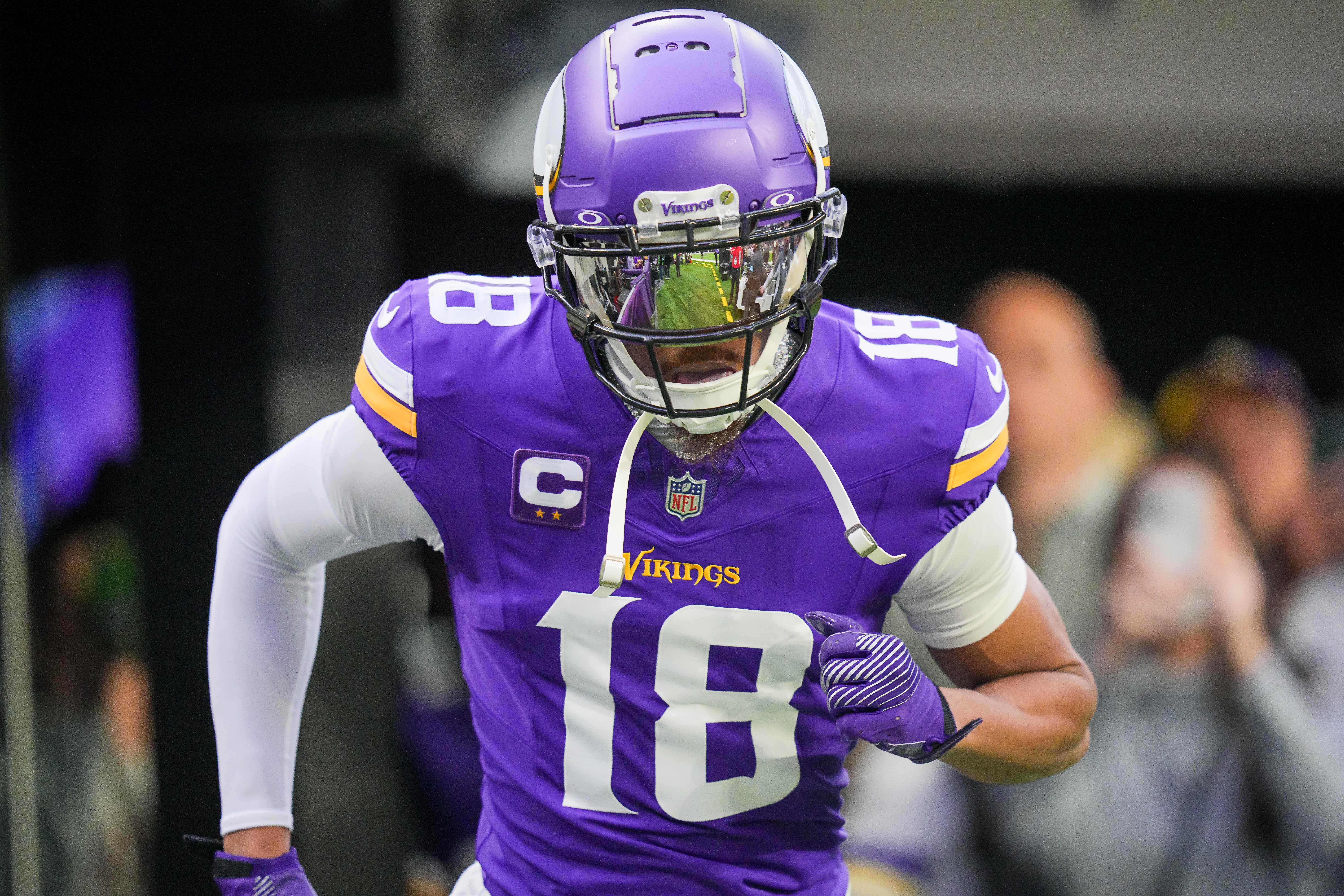 Dec 29, 2024; Minneapolis, Minnesota, USA; Minnesota Vikings wide receiver Justin Jefferson (18) takes the field before the game against Green Bay Packers at U.S. Bank Stadium.