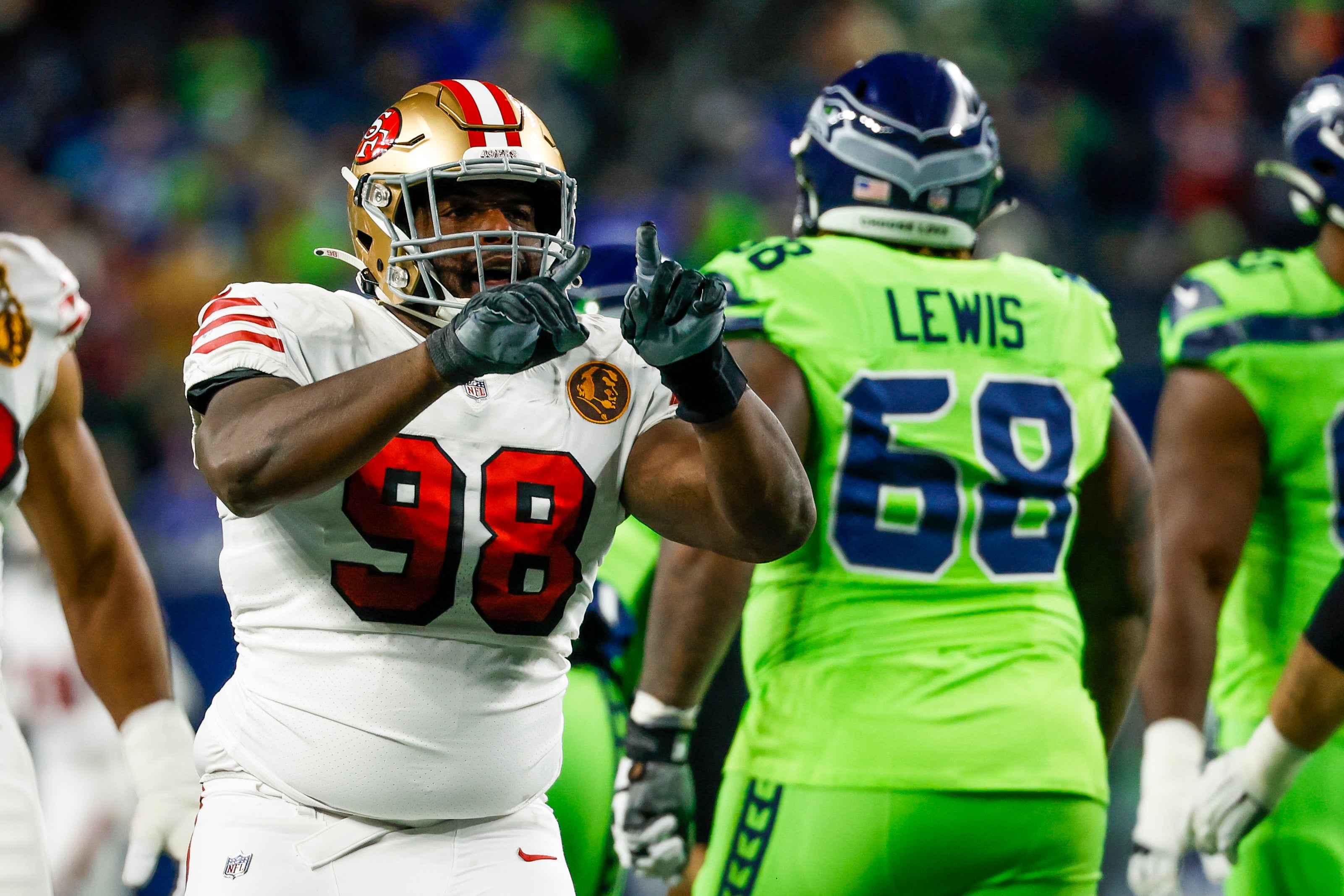 San Francisco 49ers defensive tackle Javon Hargrave (98) celebrates after a sack against the Seattle Seahawks during the second quarter at Lumen Field.