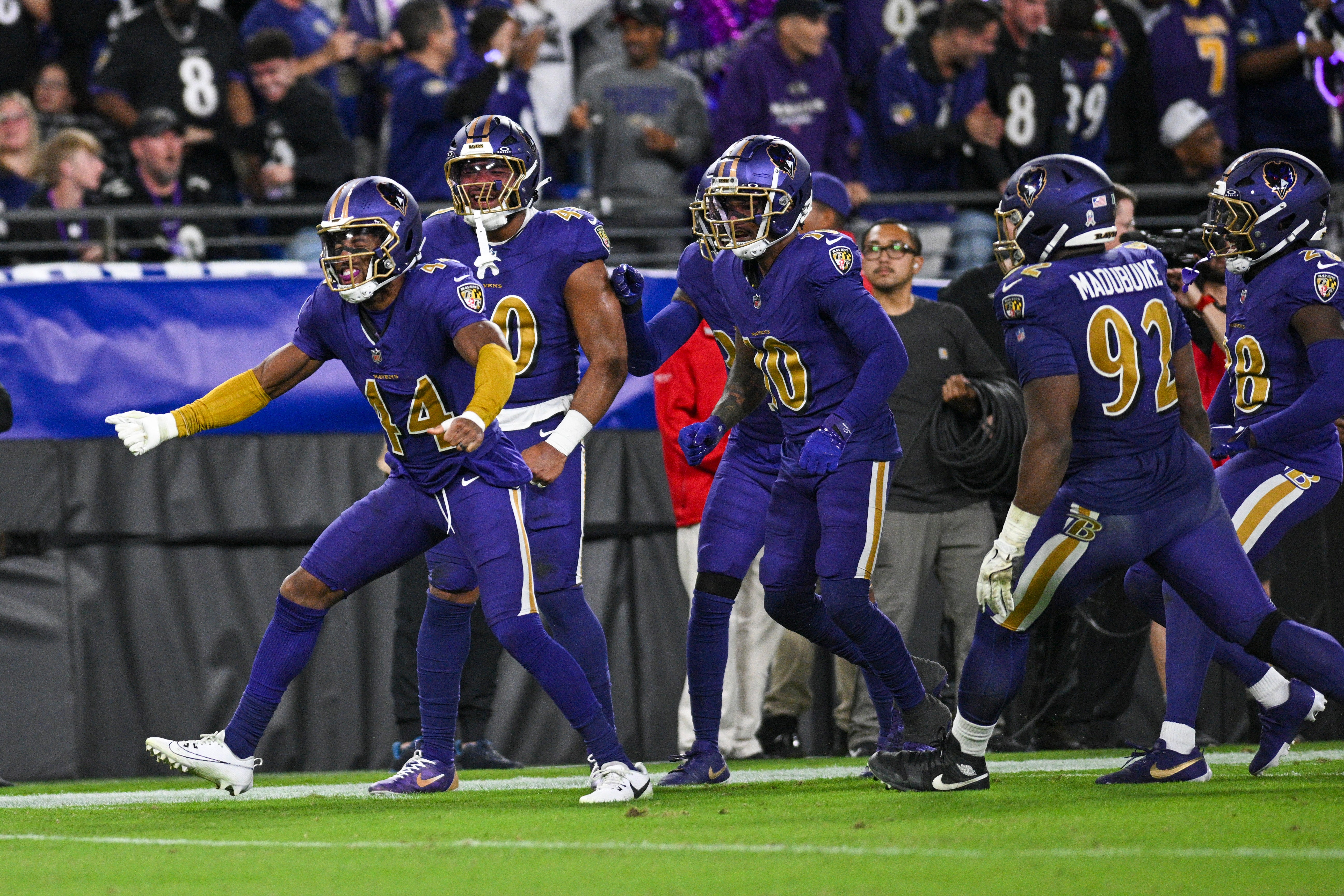 Ravens cornerback Marlon Humphrey (44) celebrates with teammates after causing a Cincinnati Bengals fumble