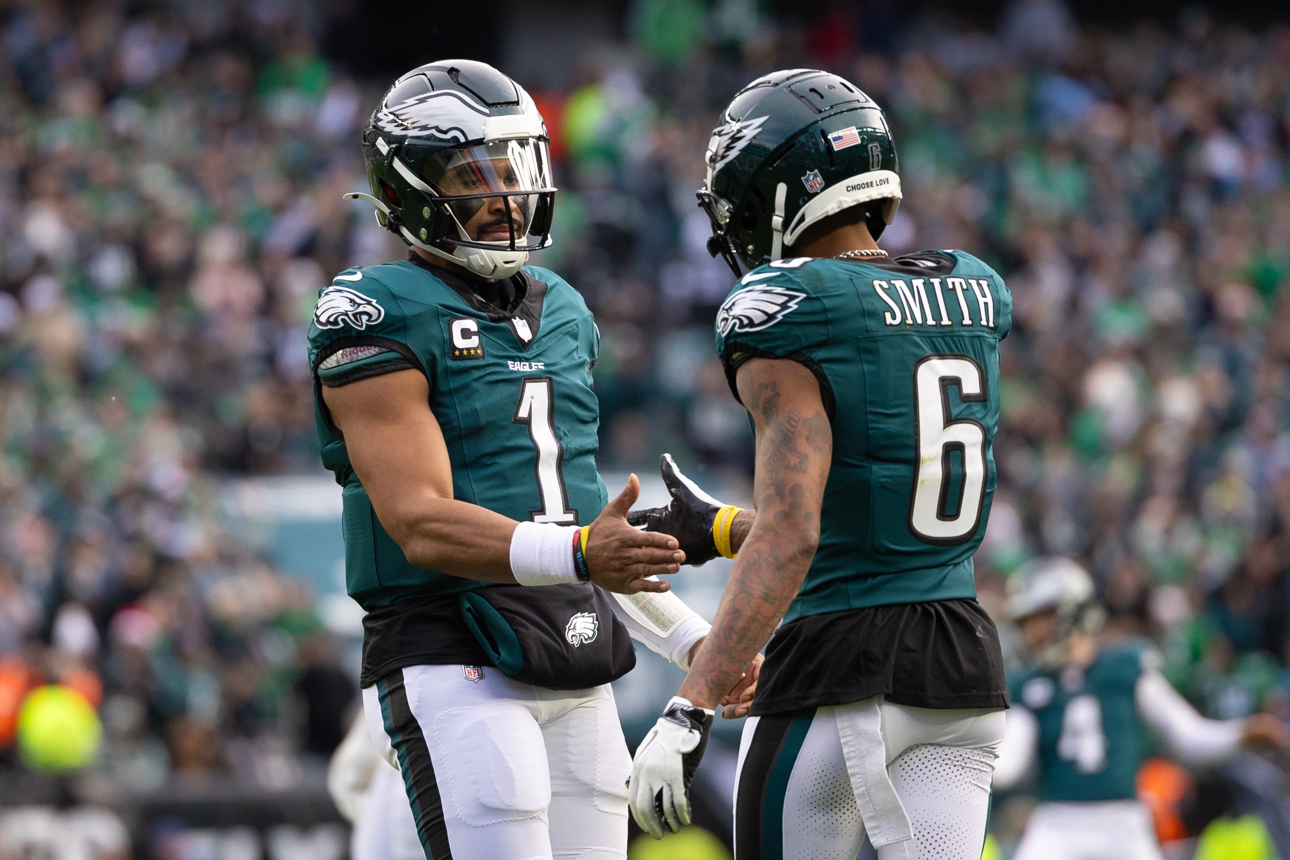 Philadelphia Eagles wide receiver DeVonta Smith (6) and quarterback Jalen Hurts (1) celebrate their touchdown connection against the Carolina Panthers during the second quarter at Lincoln Financial Field.