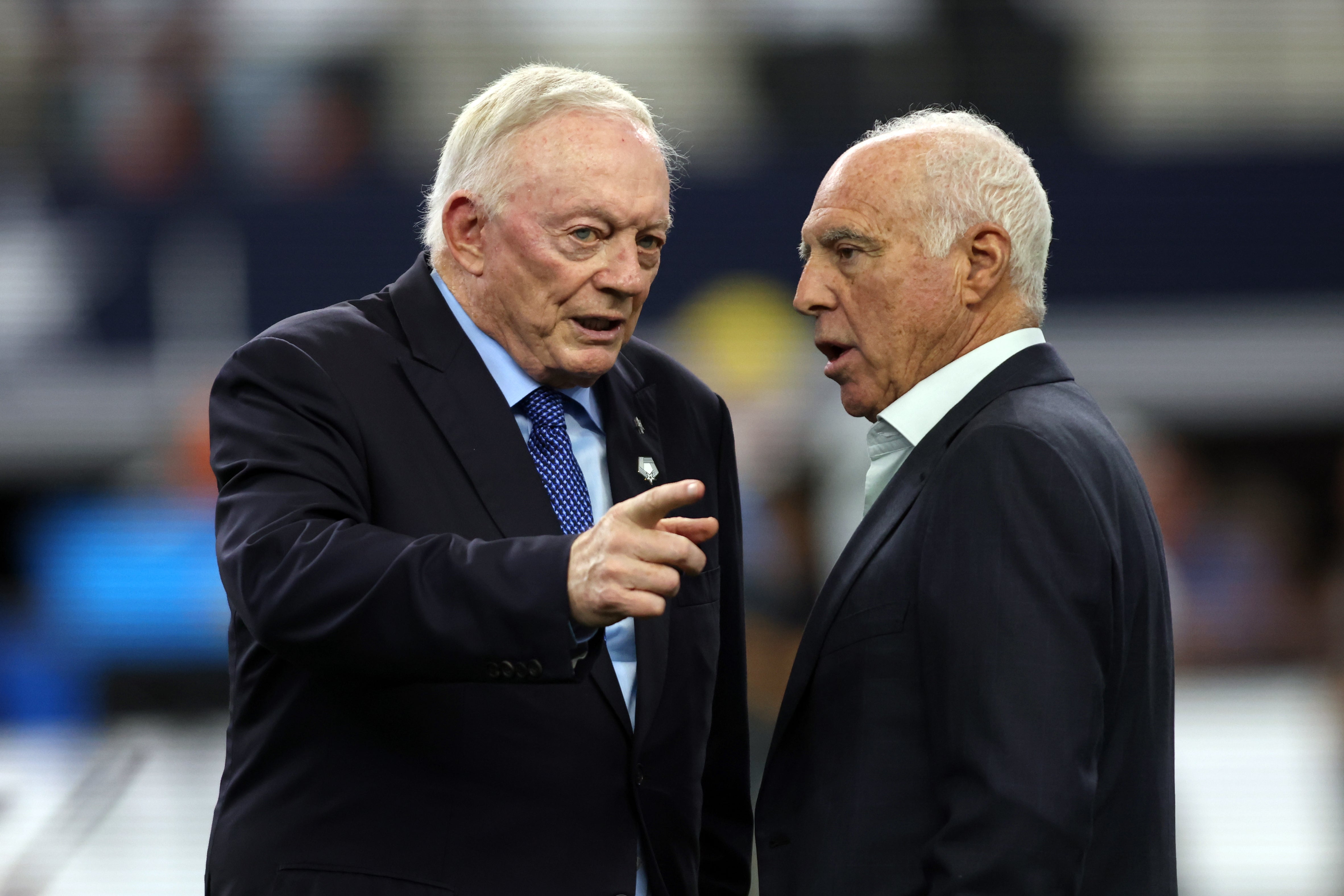 Dallas Cowboys owner Jerry Jones talks to Philadelphia Eagles owner Jeffrey Lurie before the game at AT&T Stadium.