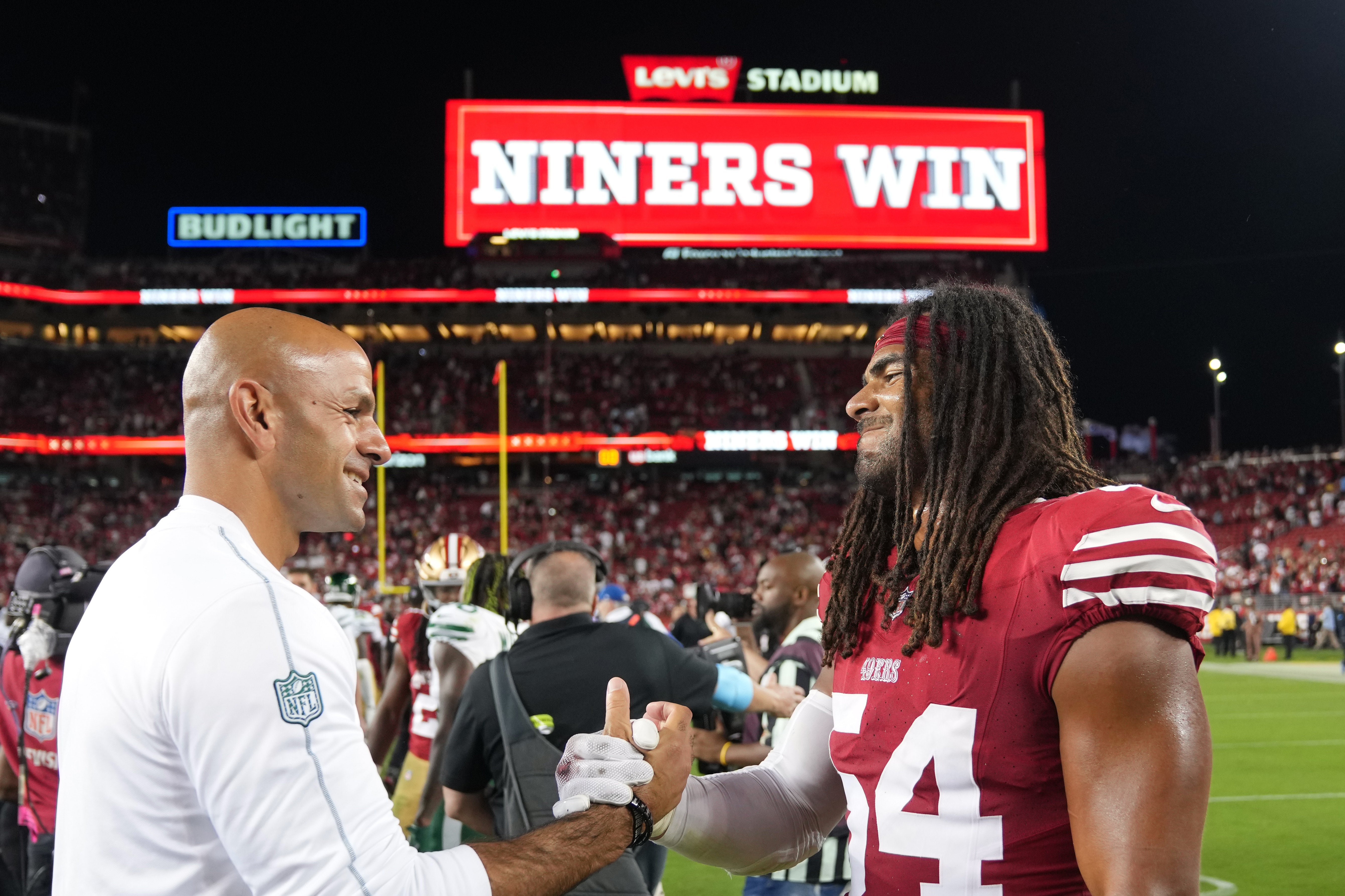 New York Jets head coach Robert Saleh (left) greets San Francisco 49ers linebacker Fred Warner (right) after the game at Levi's Stadium.