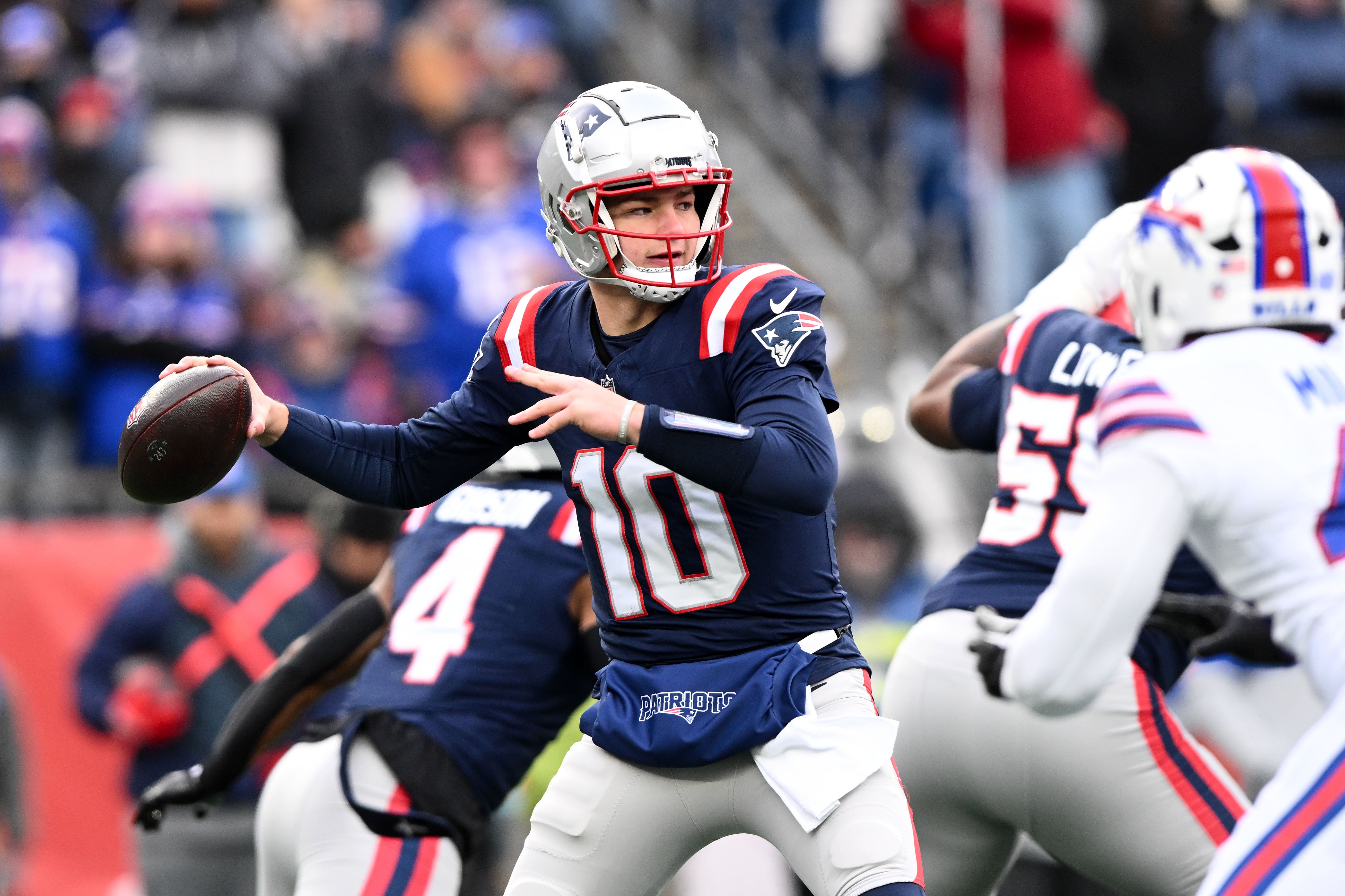 Jan 5, 2025; Foxborough, Massachusetts, USA; New England Patriots quarterback Drake Maye (10) looks to throw against the Buffalo Bills during the first half at Gillette Stadium.