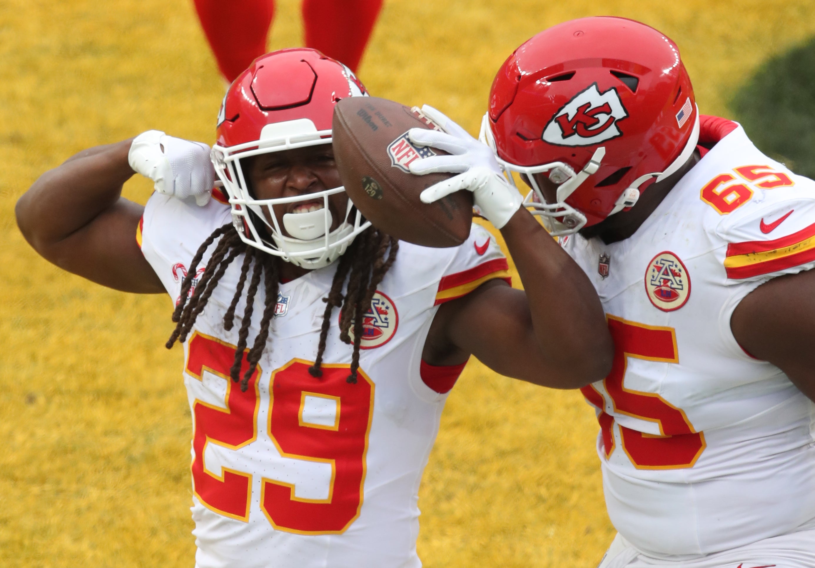 Dec 25, 2024; Pittsburgh, Pennsylvania, USA; Kansas City Chiefs running back Kareem Hunt (29) reacts with guard Trey Smith (65) after Hunt scored a touchdown against the Pittsburgh Steelers during the fourth quarter at Acrisure Stadium.