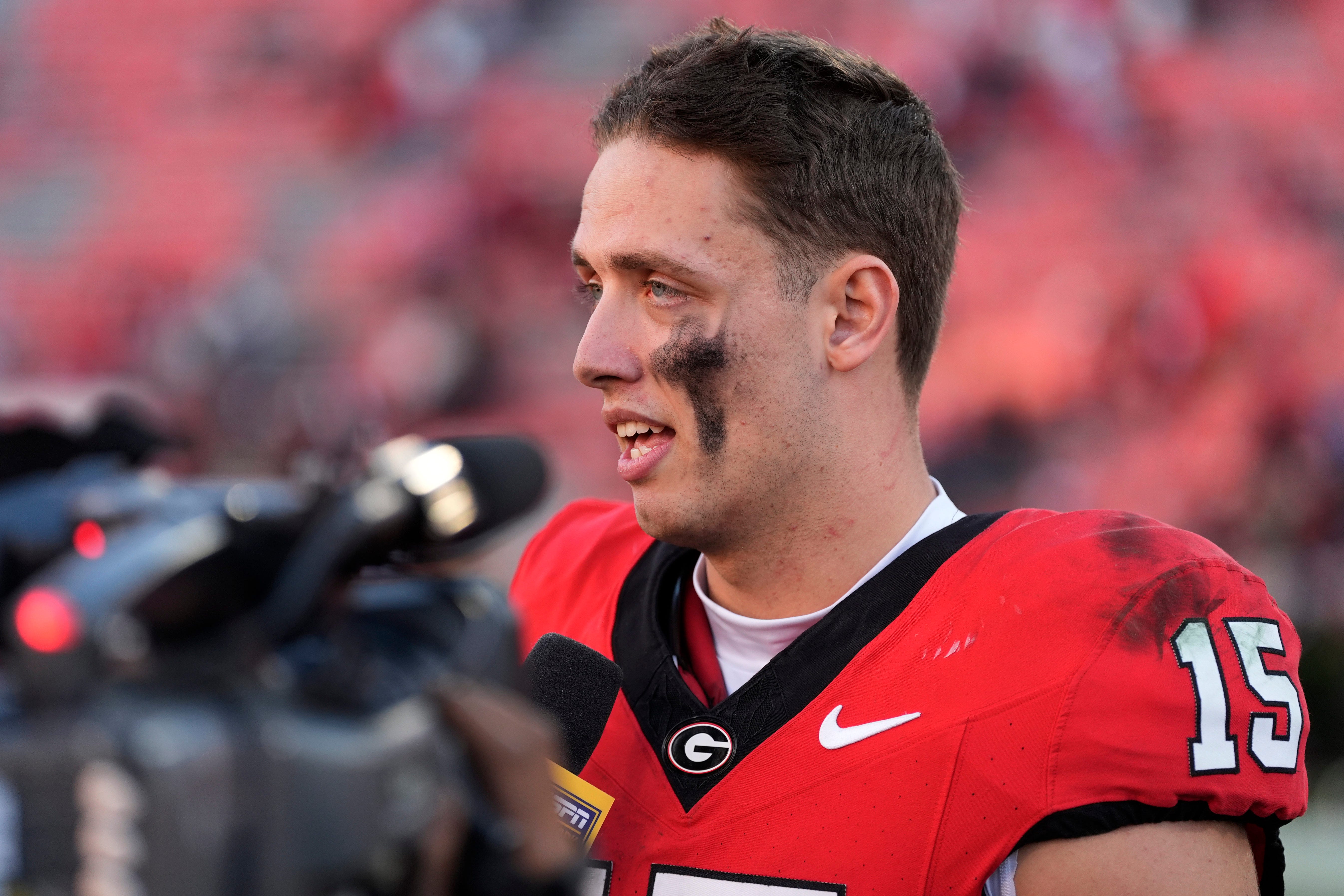 Georgia quarterback Carson Beck (15) speaks with the media after a NCAA college football game against Massachusetts in Athens, Ga., on Saturday, Nov. 23, 2024. Georgia won 59-21.