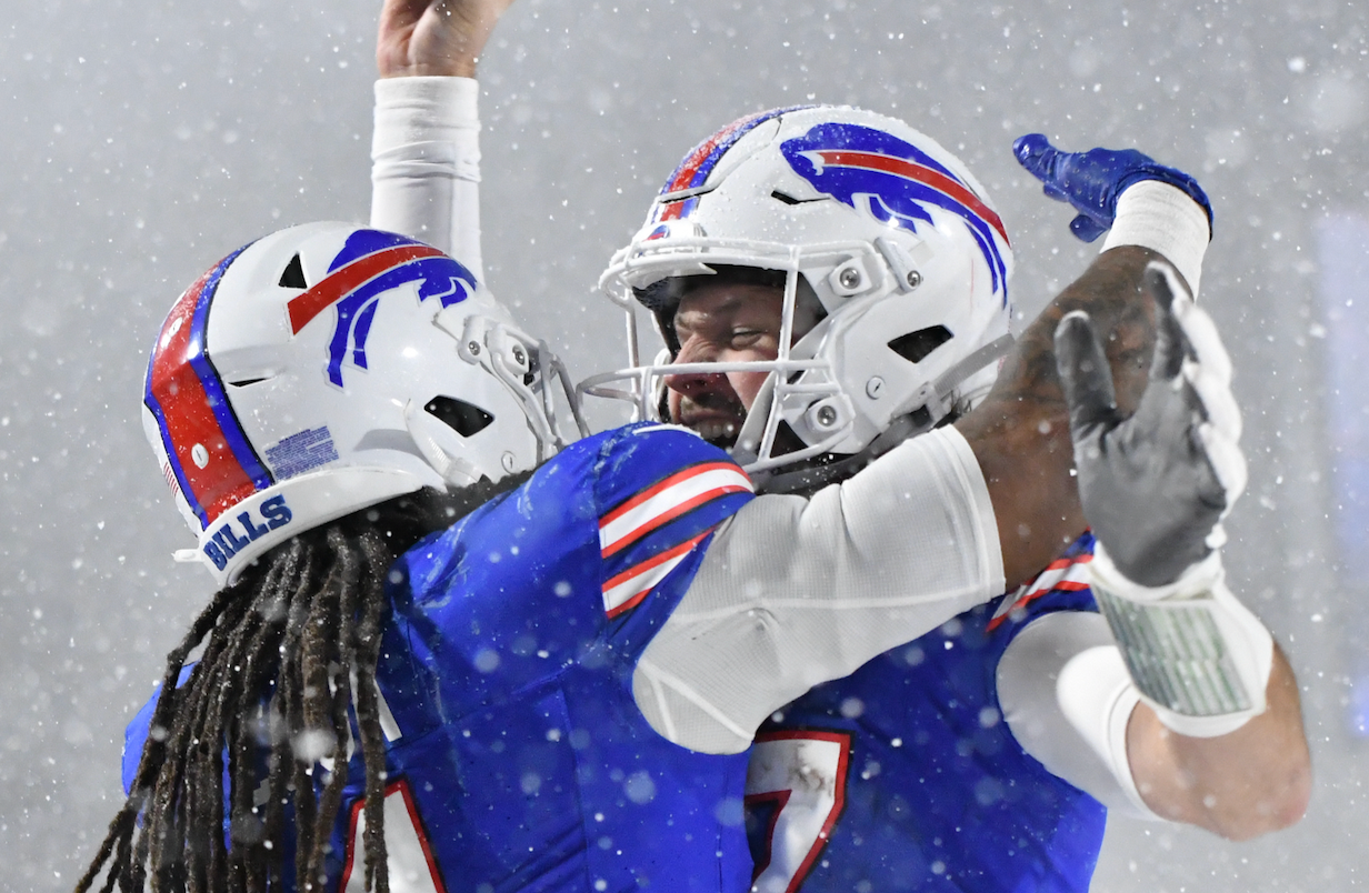 Dec 1, 2024; Orchard Park, New York, USA; Buffalo Bills quarterback Josh Allen (17) celebrates scoring a touchdown with running back James Cook (4) in the fourth quarter at Highmark Stadium