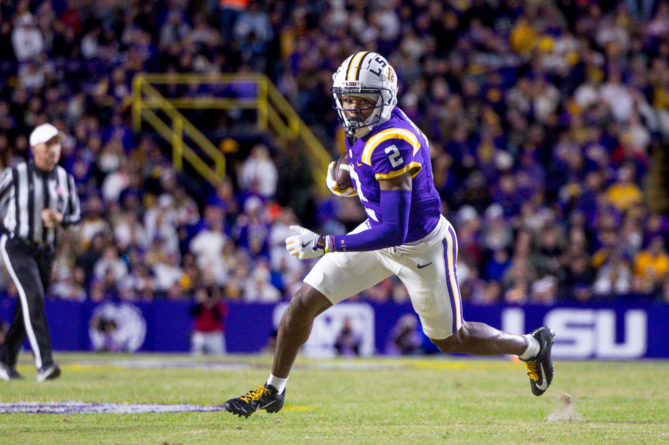 Nov 30, 2024; Baton Rouge, Louisiana, USA; LSU Tigers wide receiver Kyren Lacy (2) runs after a catch against the Oklahoma Sooners during the first quarter at Tiger Stadium.