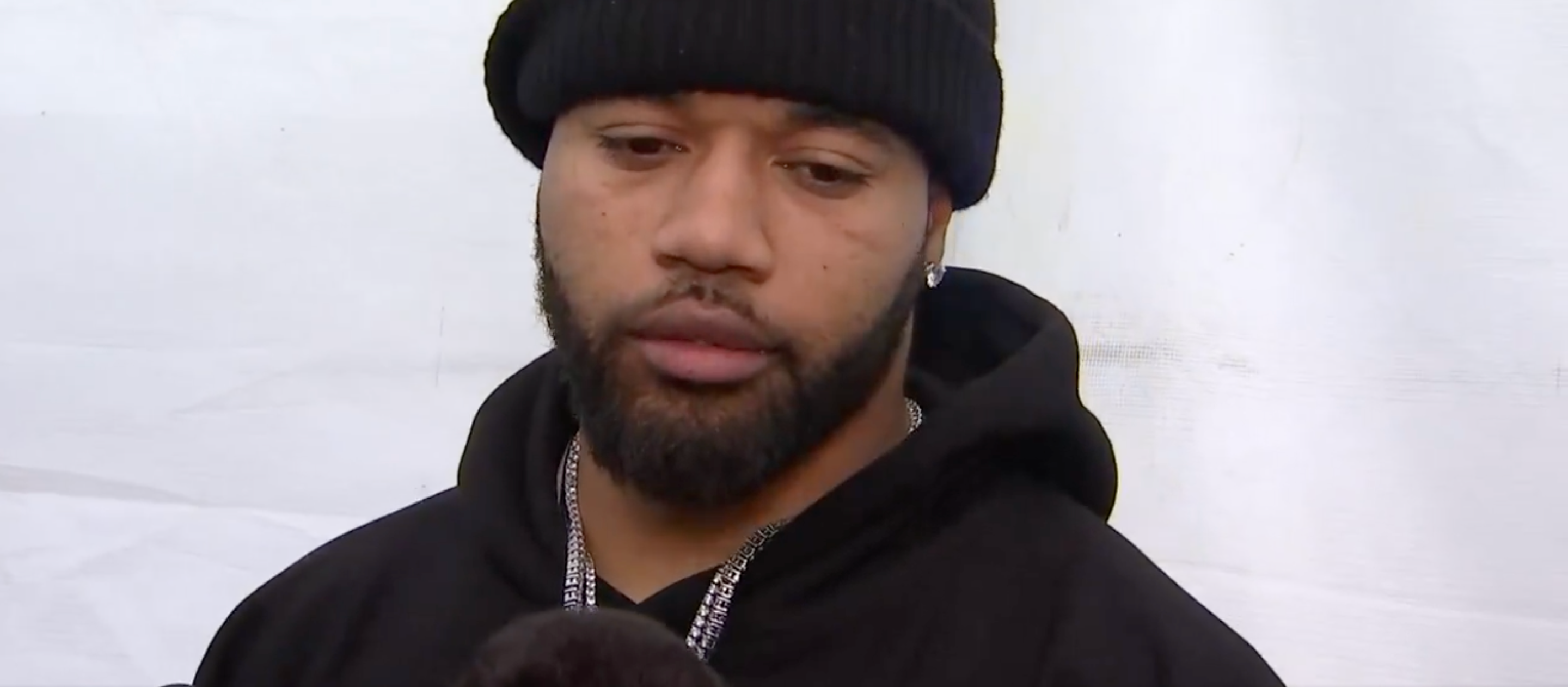 Marshon Lattimore talks to reporters ahead of the Commanders' playoff game against the Bucs.