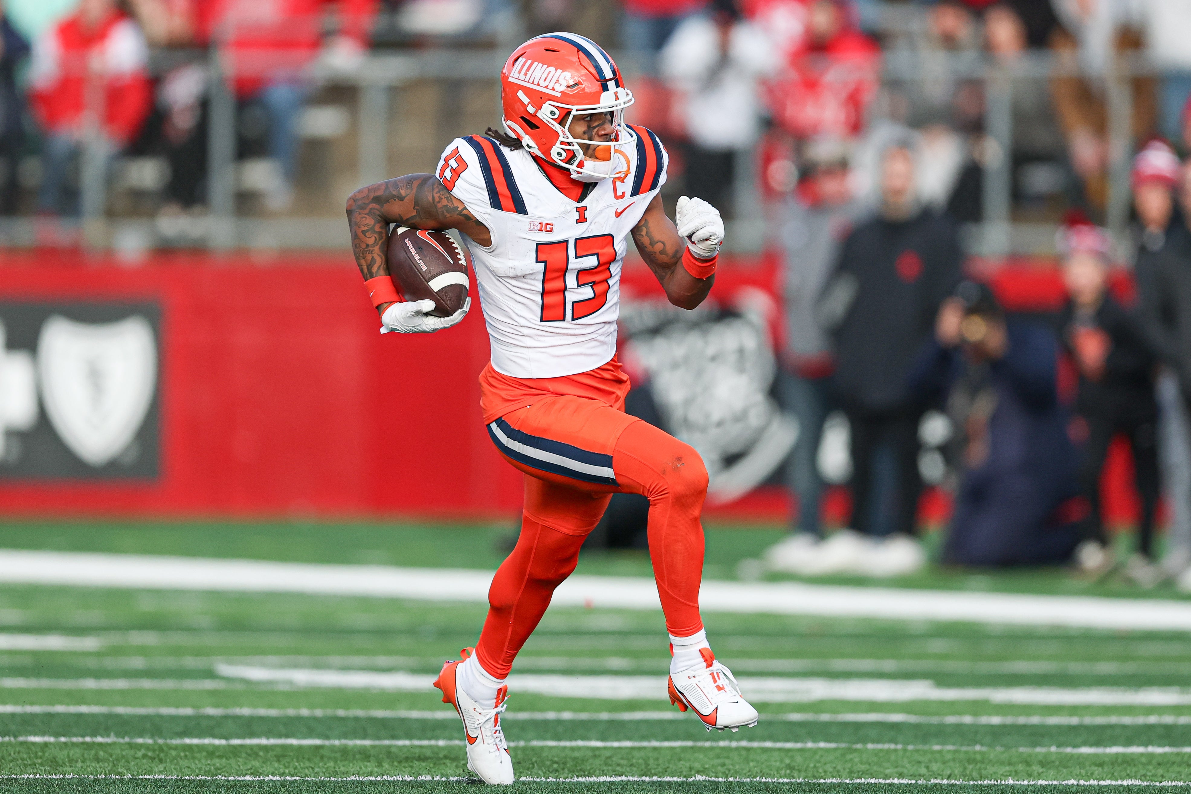 Illinois Fighting Illini wide receiver Pat Bryant (13) gains yards after catch during the second half against the Rutgers Scarlet Knights at SHI Stadium.