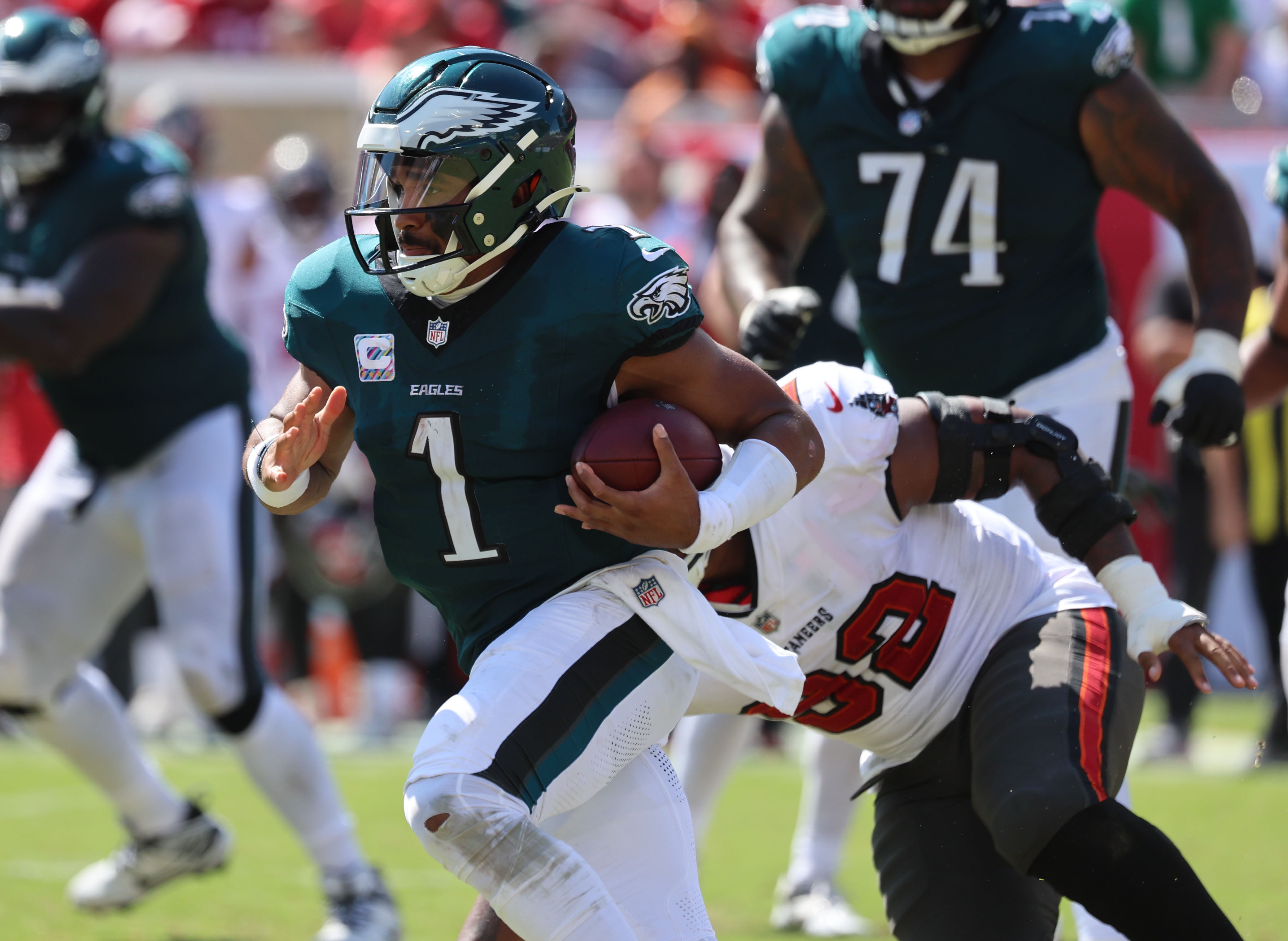 Philadelphia Eagles quarterback Jalen Hurts (1) runs with the ball against the Tampa Bay Buccaneers during the second half at Raymond James Stadium.