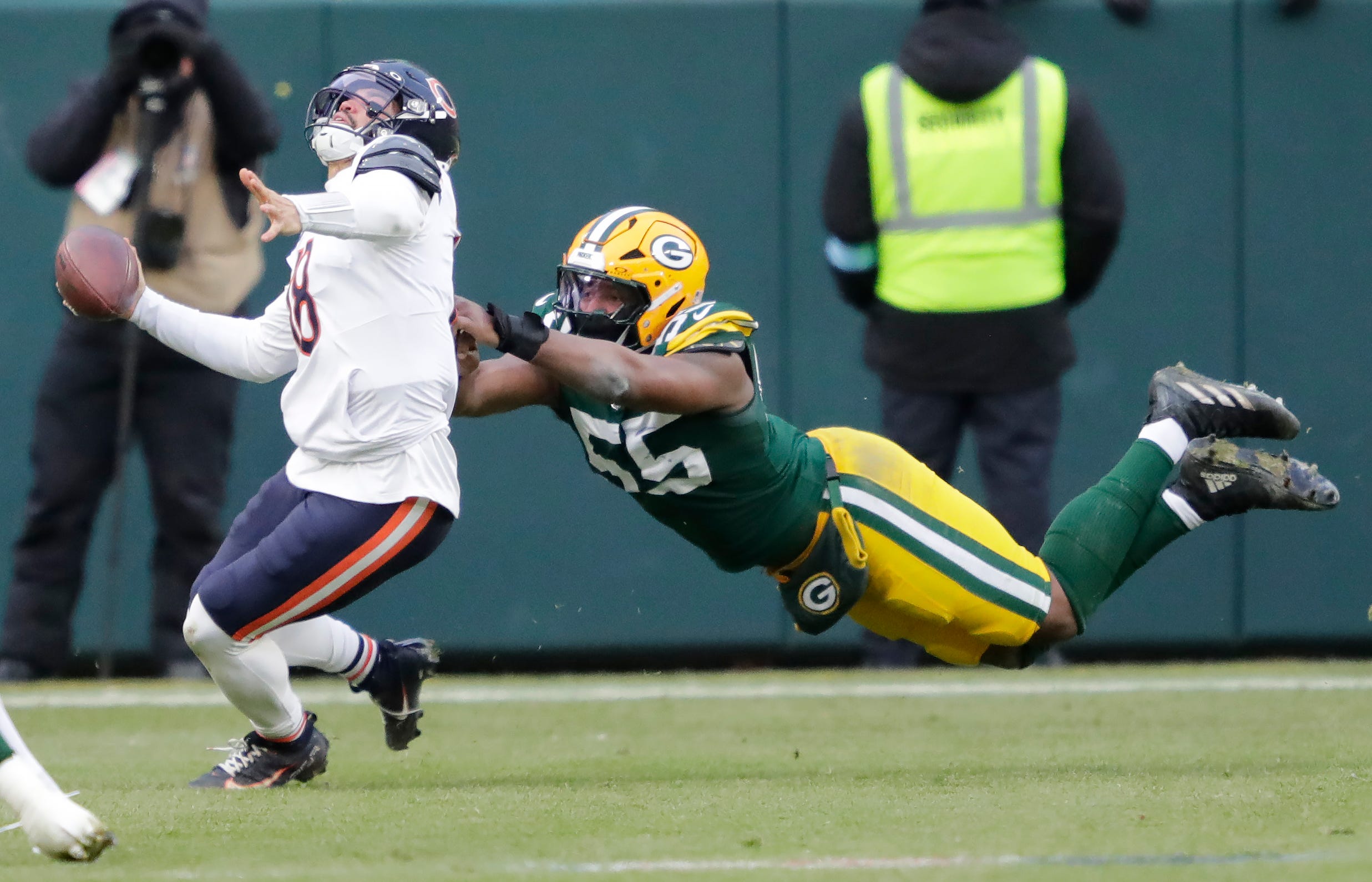 Green Bay Packers defensive end Kingsley Enagbare (55) horse collars Chicago Bears quarterback Caleb Williams (18) in the fourth quarter during their football game Sunday, January 5, 2025, at Lambeau Field in Green Bay, Wisconsin.