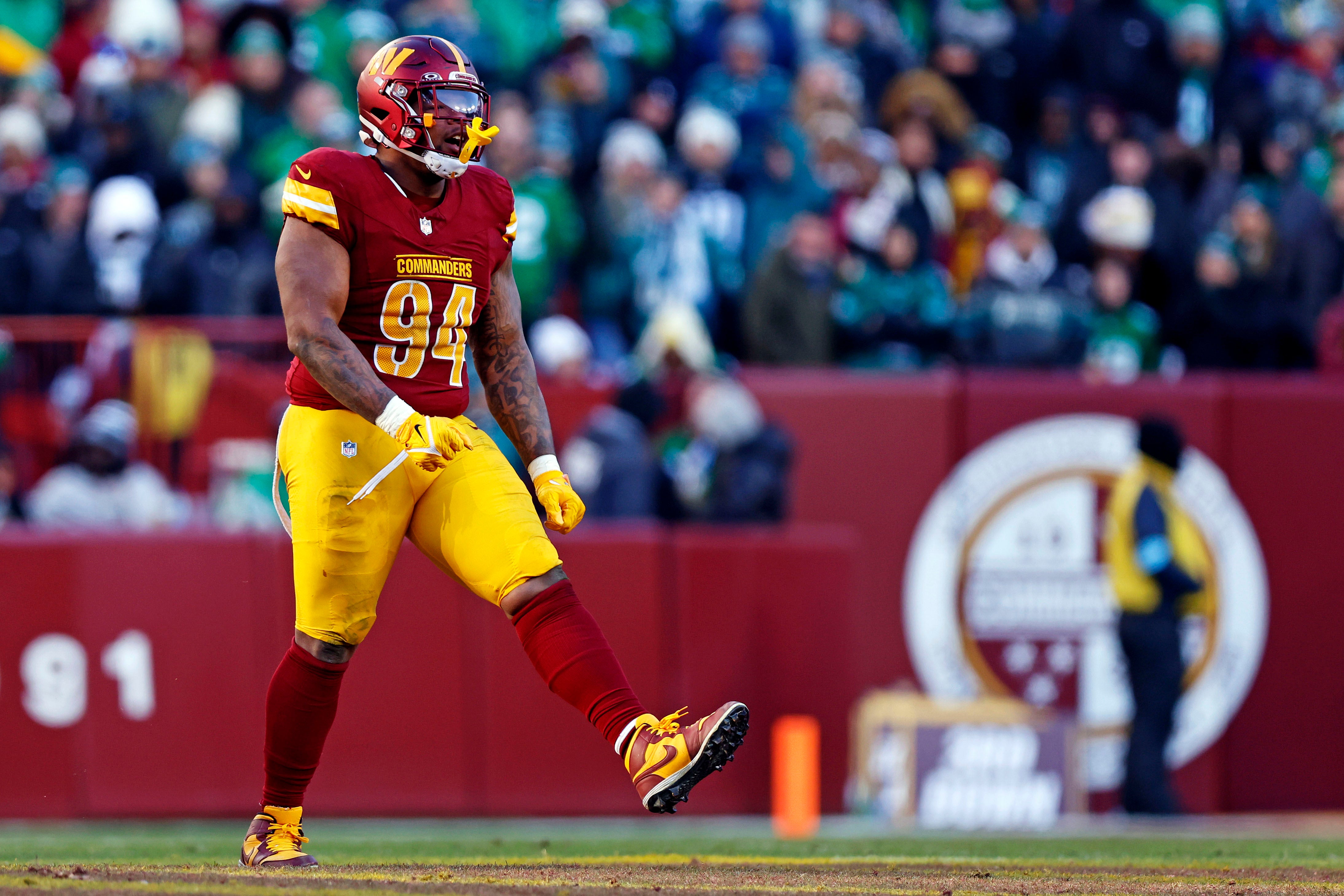 Washington Commanders defensive tackle Daron Payne (94) celebrates after a play during the third quarter against the Philadelphia Eagles at Northwest Stadium.