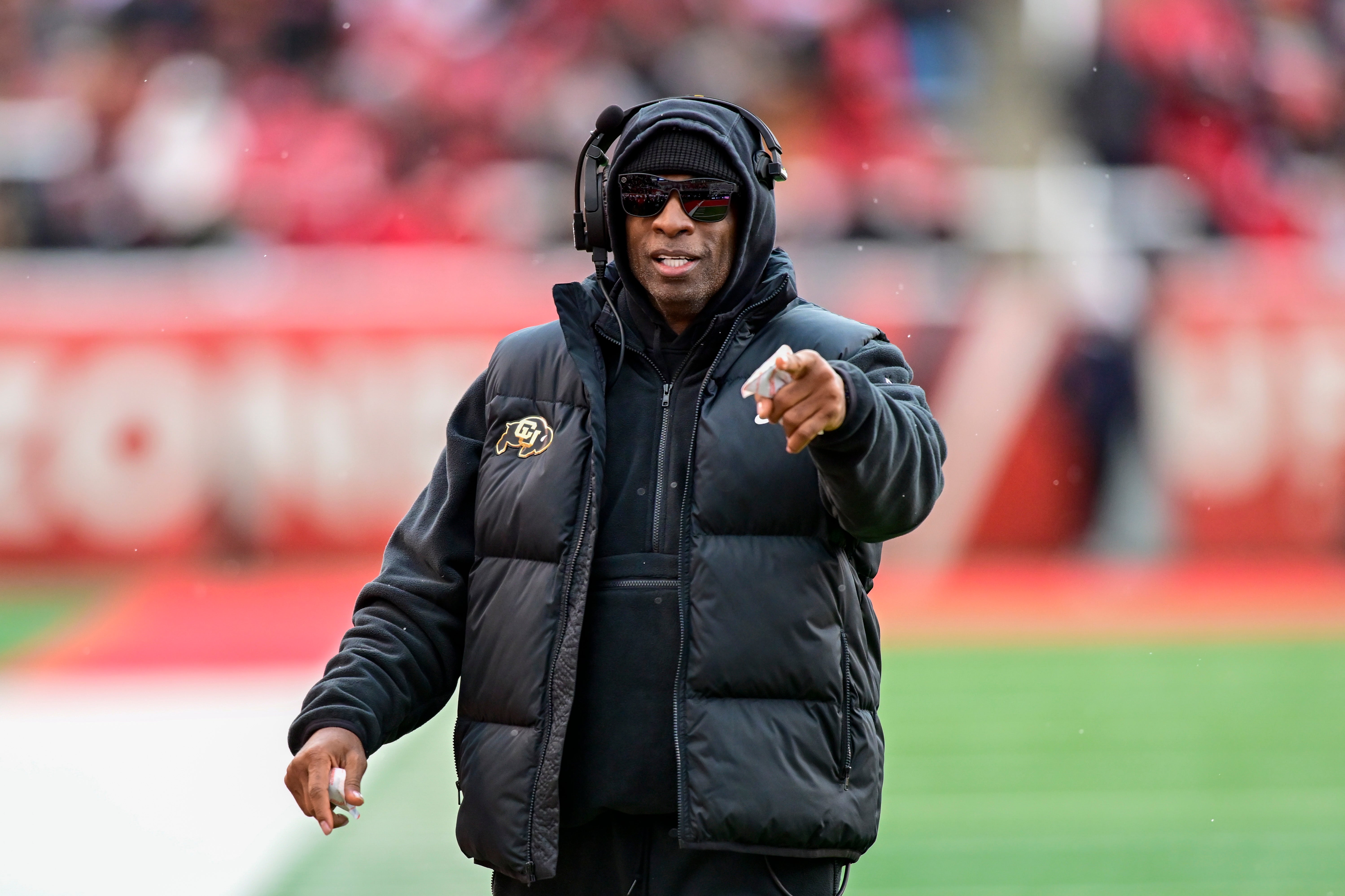 Colorado Buffaloes head coach Deion Sanders on the field against the Utah Utes at Rice-Eccles Stadium. Christopher Creveling-Imagn Images