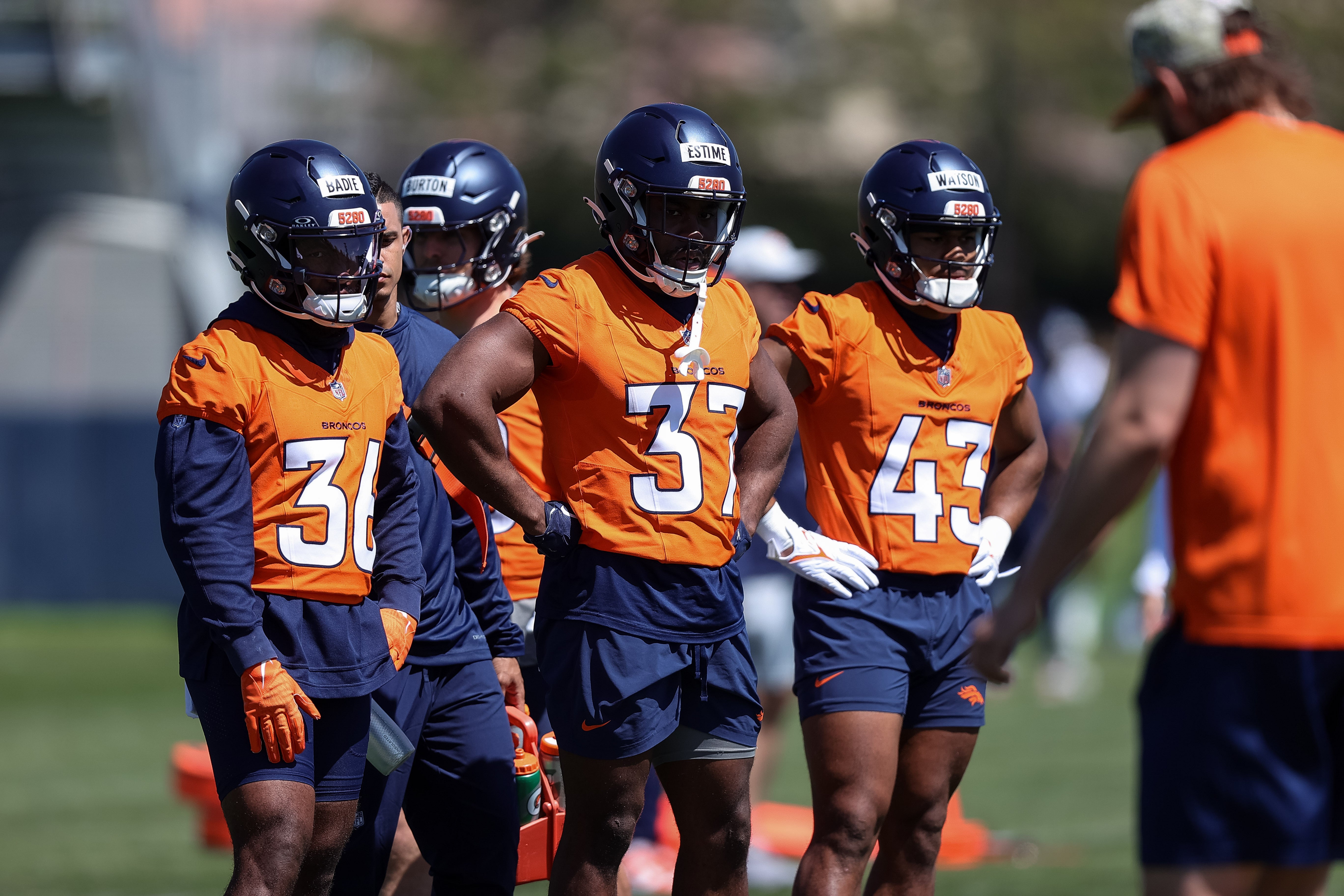 May 23, 2024; Englewood, CO, USA; Denver Broncos running back Audric Estime (37) and running back Tyler Badie (36) and running back Blake Watson (43) during organized team activities at Centura Health Training Center.
