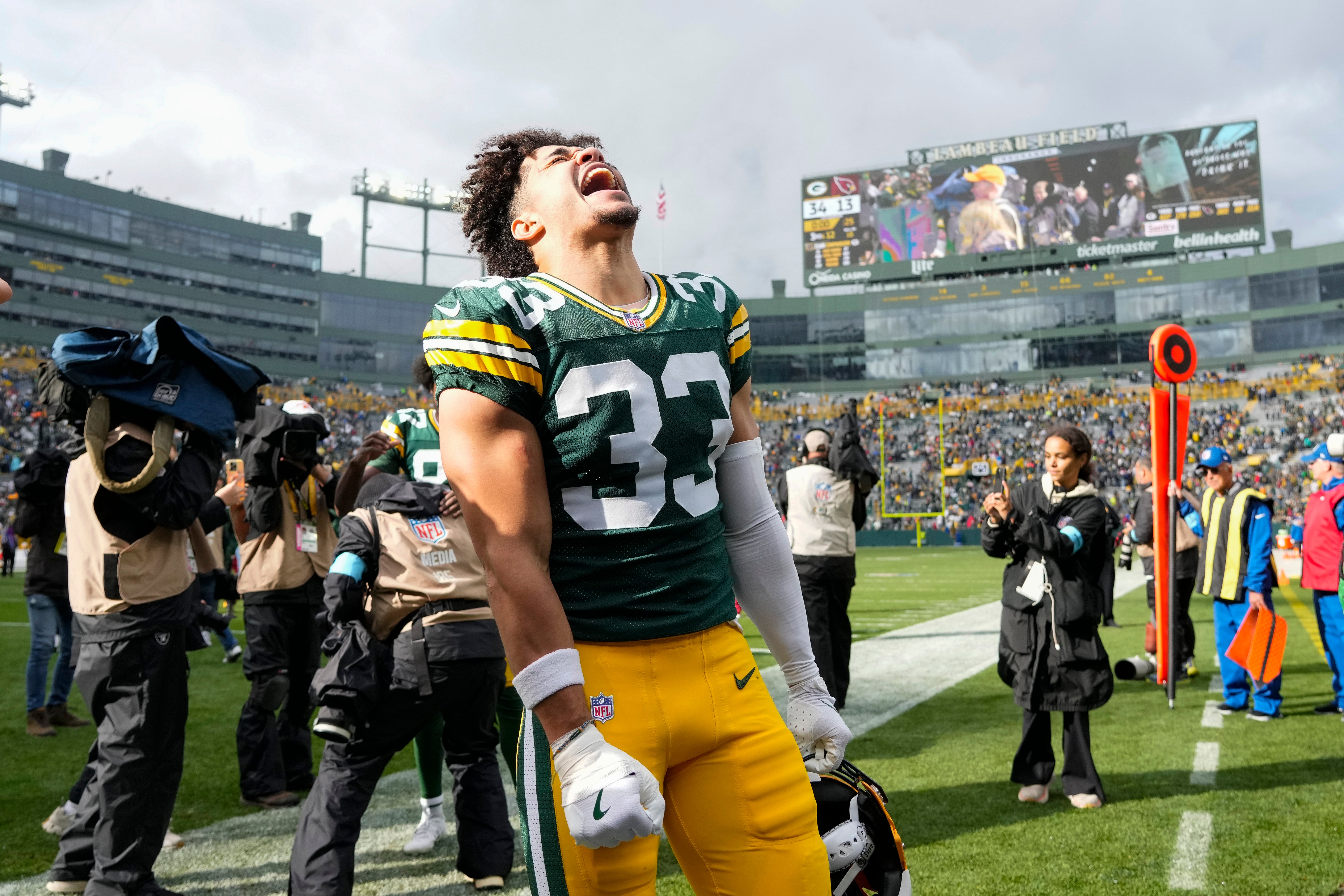 Green Bay Packers safety Evan Williams (33) celebrates following the game against the Arizona Cardinals at Lambeau Field.