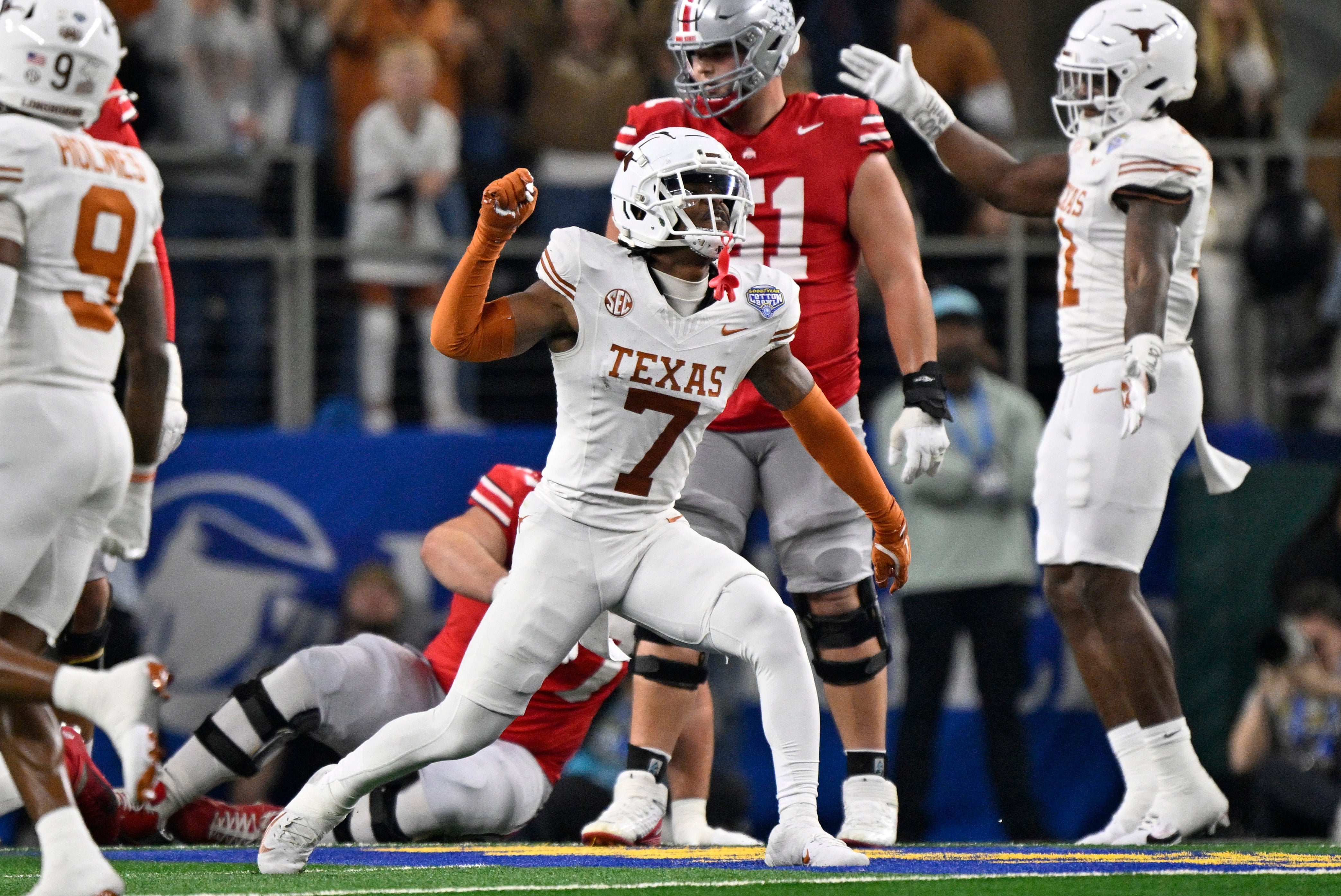 Jan 10, 2025; Arlington, Texas, USA; Texas Longhorns defensive back Jahdae Barron (7) celebrates after a sack during the second quarter of the College Football Playoff semifinal against the Ohio State Buckeyes in the Cotton Bowl at AT&T Stadium.