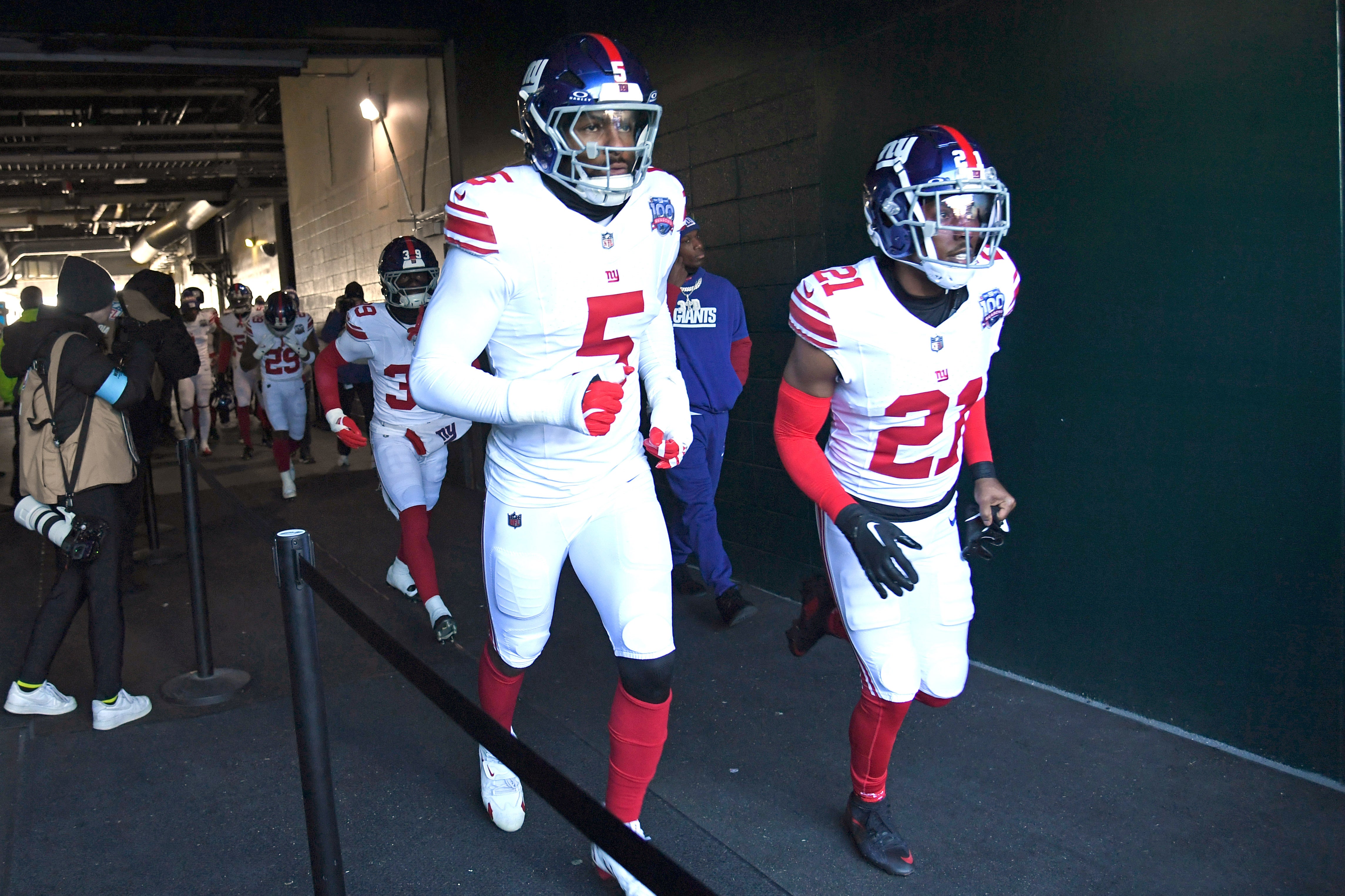 Jan 5, 2025; Philadelphia, Pennsylvania, USA; New York Giants linebacker Kayvon Thibodeaux (5) and cornerback Adoree' Jackson (21) take the field against the Philadelphia Eagles at Lincoln Financial Field.