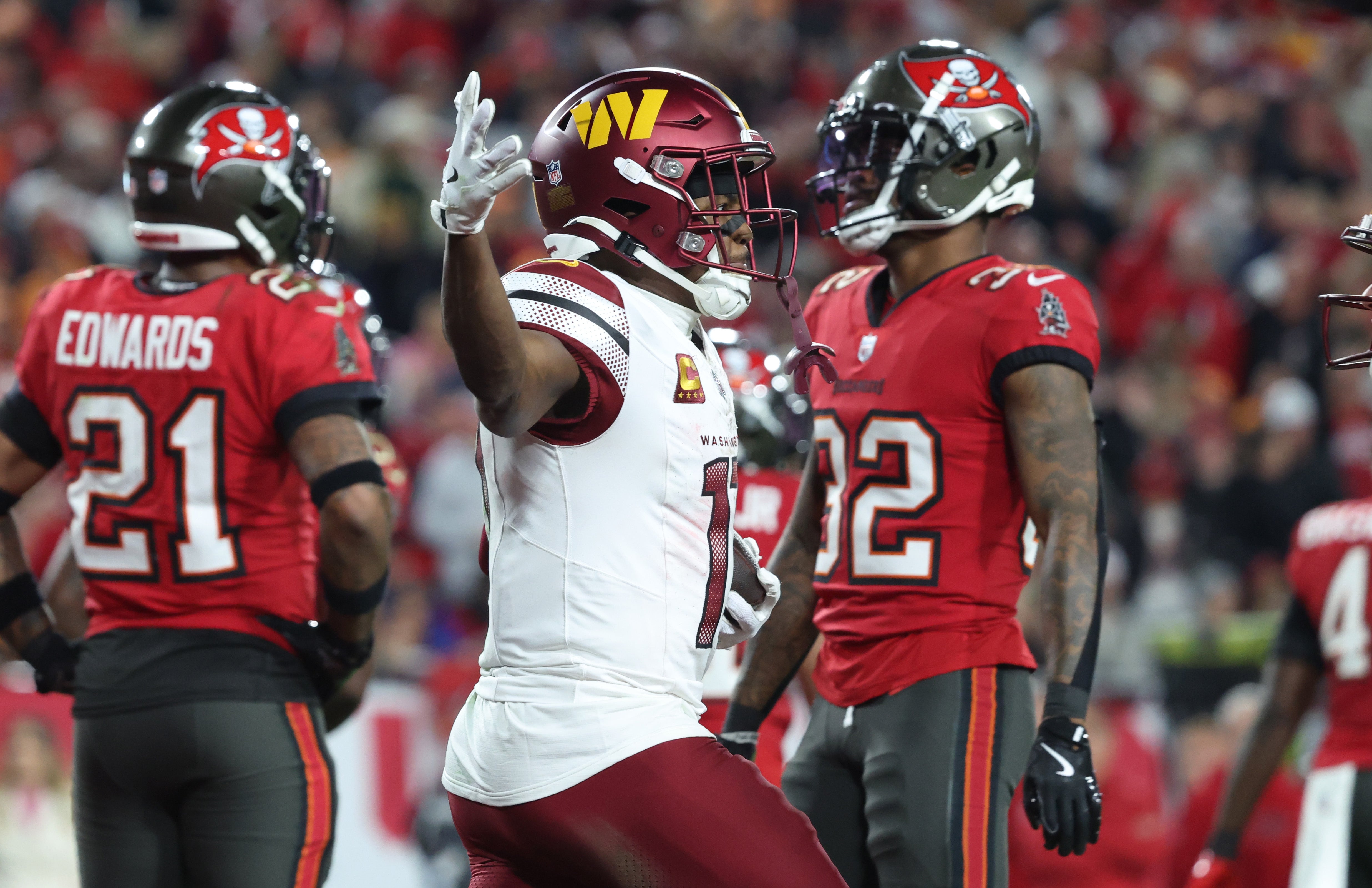 Jan 12, 2025; Tampa, Florida, USA; Washington Commanders wide receiver Terry McLaurin (17) reacts after catching a touchdown during the fourth quarter of a NFC wild card playoff against the Tampa Bay Buccaneers at Raymond James Stadium.