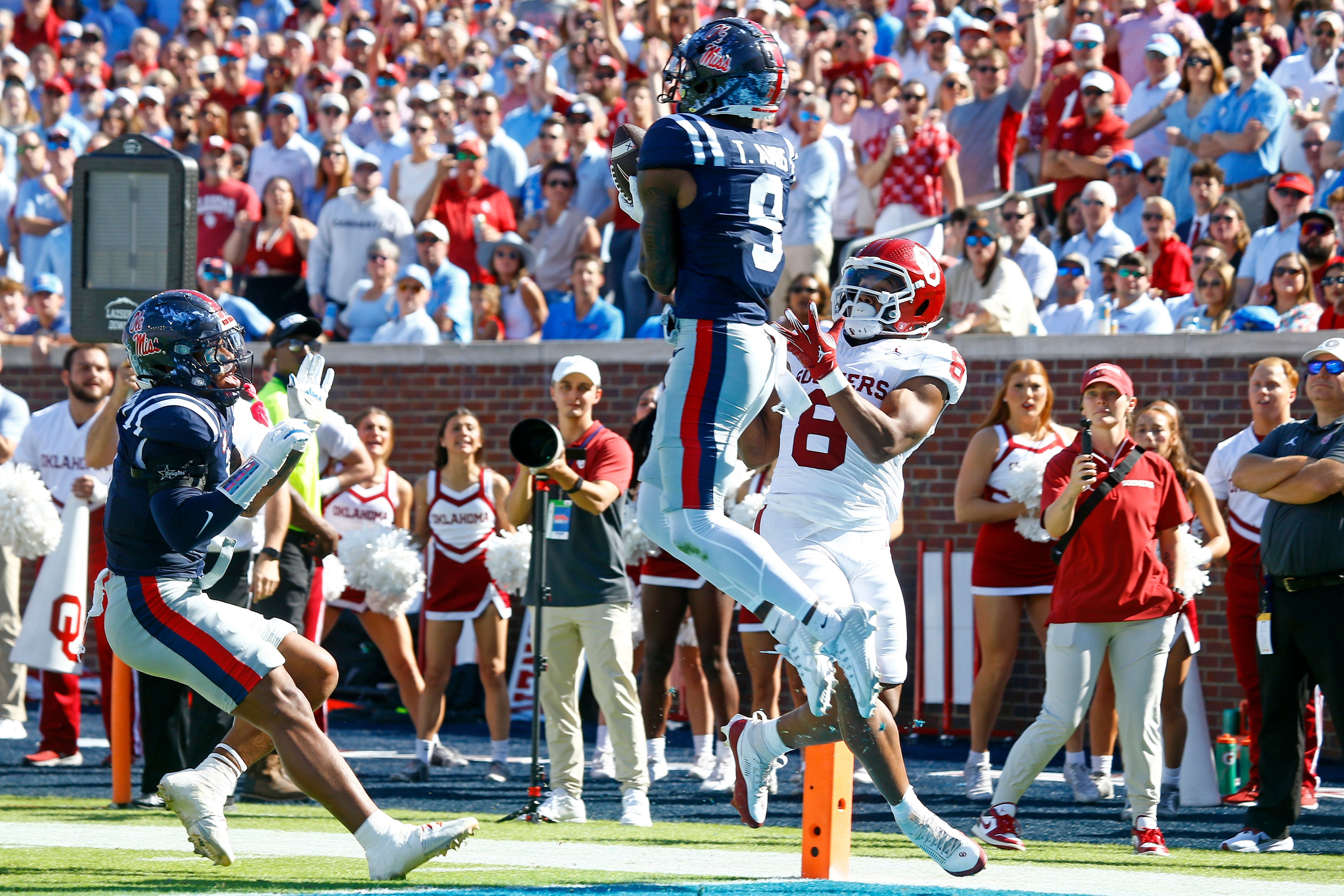 Oct 26, 2024; Oxford, Mississippi, USA; Mississippi Rebels defensive back Trey Amos (9) catches the ball as he steps out of bounds over Oklahoma Sooners running back Taylor Tatum (8) during the first half at Vaught-Hemingway Stadium.